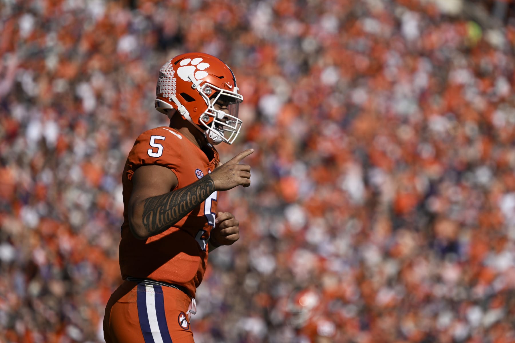 CLEMSON, SOUTH CAROLINA - NOVEMBER 26: DJ Uiagalelei #5 of the Clemson Tigers celebrates his first quarter touchdown against the South Carolina Gamecocks at Memorial Stadium on November 26, 2022 in Clemson, South Carolina. (Photo by Eakin Howard/Getty Images)