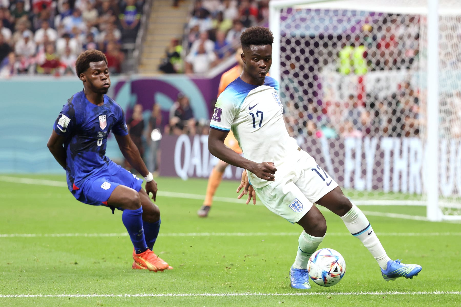 AL KHOR, QATAR - NOVEMBER 25: Bukayo Saka of England, Yunus Musah of USA (L during the FIFA World Cup Qatar 2022 Group B match between England and USA at Al Bayt Stadium on November 25, 2022 in Al Khor, Qatar. (Photo by Jean Catuffe/Getty Images)