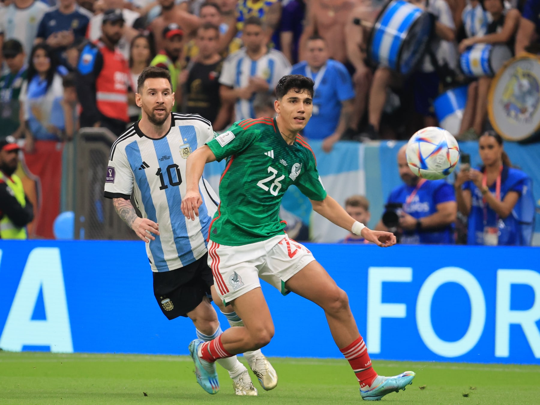 LUSAIL CITY, QATAR - NOVEMBER 26: Lionel Messi (10) of Argentina in action against Kevin Alvarezile (26) of Mexico during the FIFA World Cup Qatar 2022 Group C match between Argentina and Mexico at Lusail Stadium on November 26, 2022 in Lusail City, Qatar. (Photo by Mohammed Dabbous/Anadolu Agency via Getty Images)