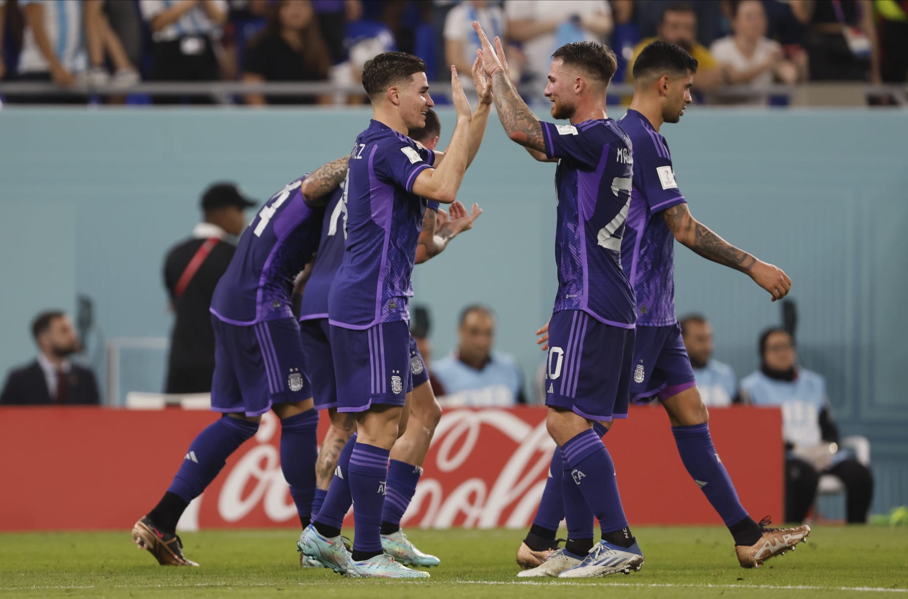 DOHA, QATAR - NOVEMBER 30: Julian Alvarez of Argentina and Alexis Mac Allister of Argentina celebrate during the FIFA World Cup Qatar 2022 Group C match between Poland and Argentina at Stadium 974 on November 30, 2022 in Doha, Qatar. (Photo by Richard Sellers/Getty Images)