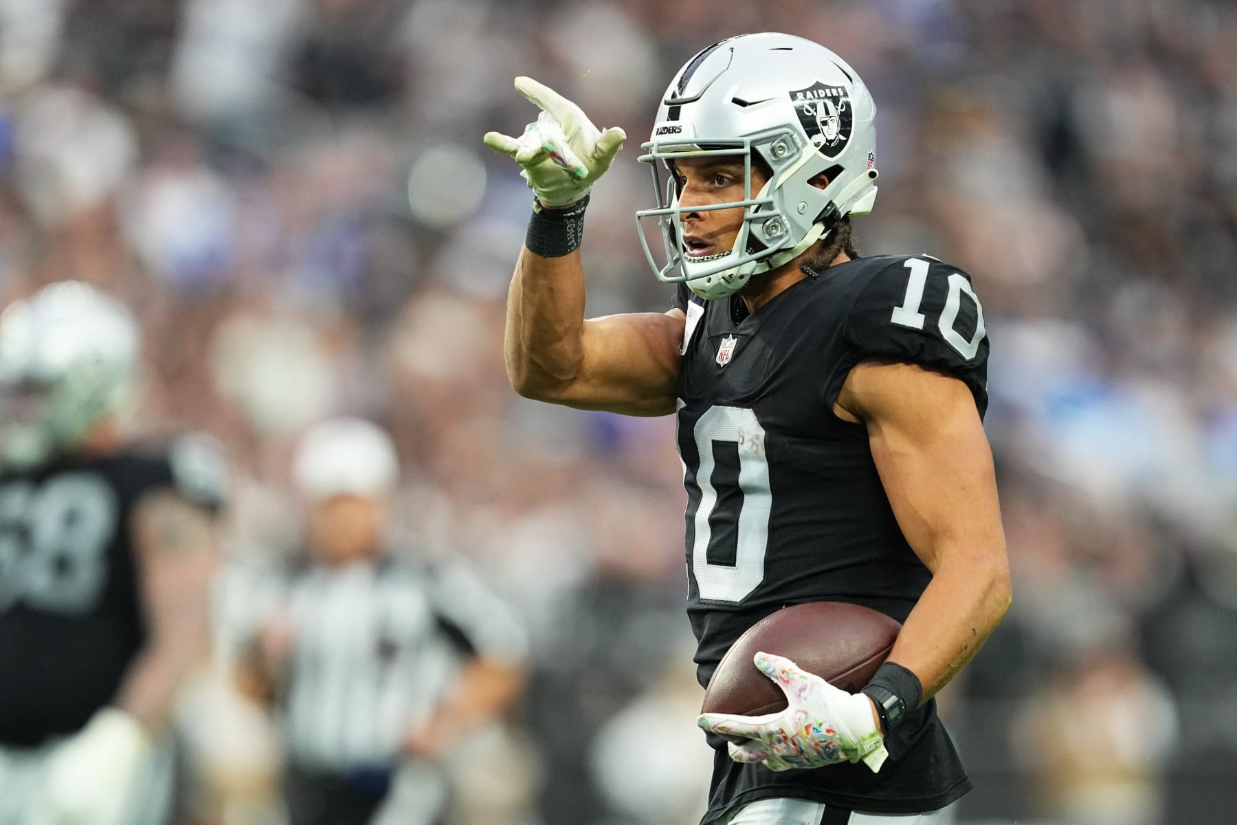 LAS VEGAS, NEVADA - DECEMBER 04: Mack Hollins #10 of the Las Vegas Raiders reacts after a first first down in the first quarter of a game against the Los Angeles Chargers at Allegiant Stadium on December 04, 2022 in Las Vegas, Nevada. (Photo by Chris Unger/Getty Images)