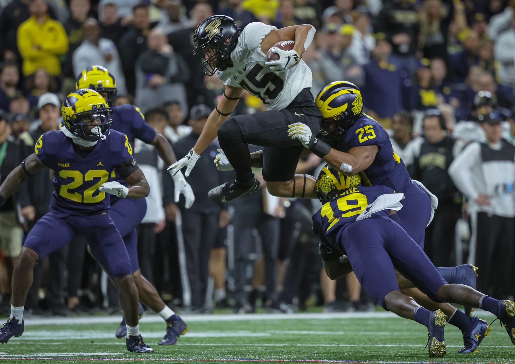 INDIANAPOLIS, IN - DECEMBER 03: Devin Mockobee #45 of the Purdue Boilermakers runs the ball during the Big Ten Championship against the Michigan Wolverines at Lucas Oil Stadium on December 3, 2022 in Indianapolis, Indiana. (Photo by Michael Hickey/Getty Images)