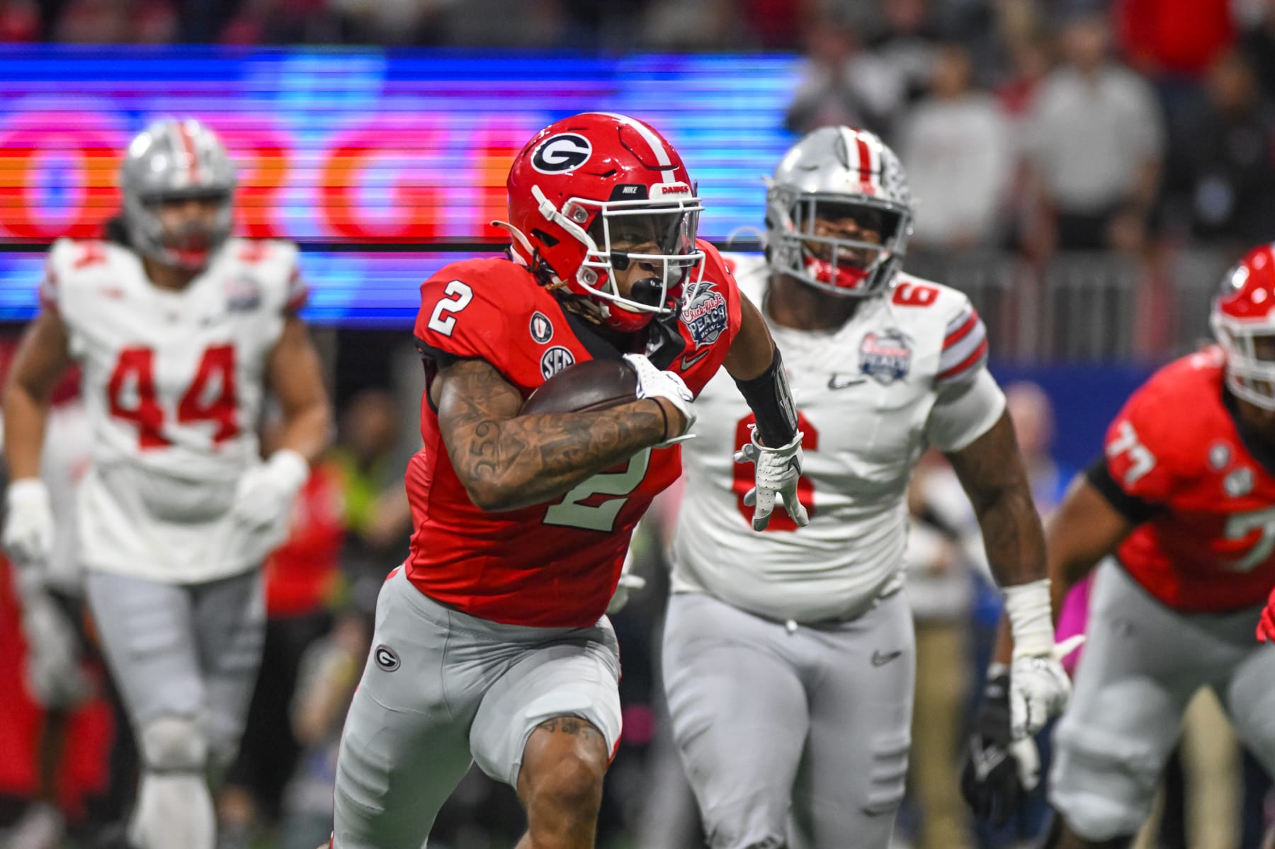 ATLANTA, GA - DECEMBER 31: Georgia Bulldogs running back Kendall Milton (2) scores a touchdown during the Chick-fil-A Peach Bowl College Football Playoff Semifinal game between the Ohio State Buckeyes and the Georgia Bulldogs on December 31, 2022, at Mercedes-Benz Stadium in Atlanta, Georgia. (Photo by John Adams/Icon Sportswire via Getty Images)
