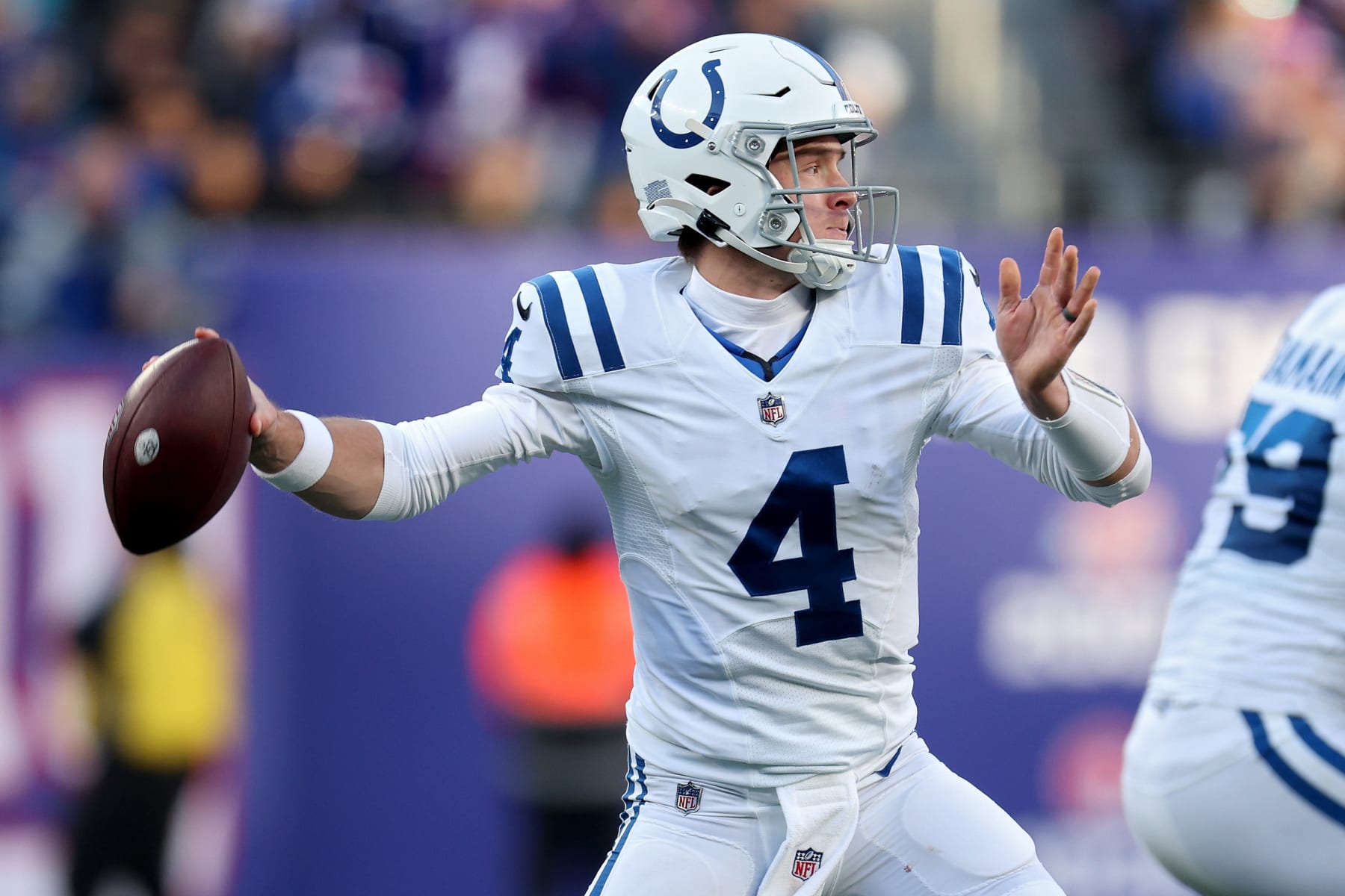 EAST RUTHERFORD, NEW JERSEY - JANUARY 01: Sam Ehlinger #4 of the Indianapolis Colts passes against the New York Giants during the fourth quarter at MetLife Stadium on January 01, 2023 in East Rutherford, New Jersey. (Photo by Jamie Squire/Getty Images)