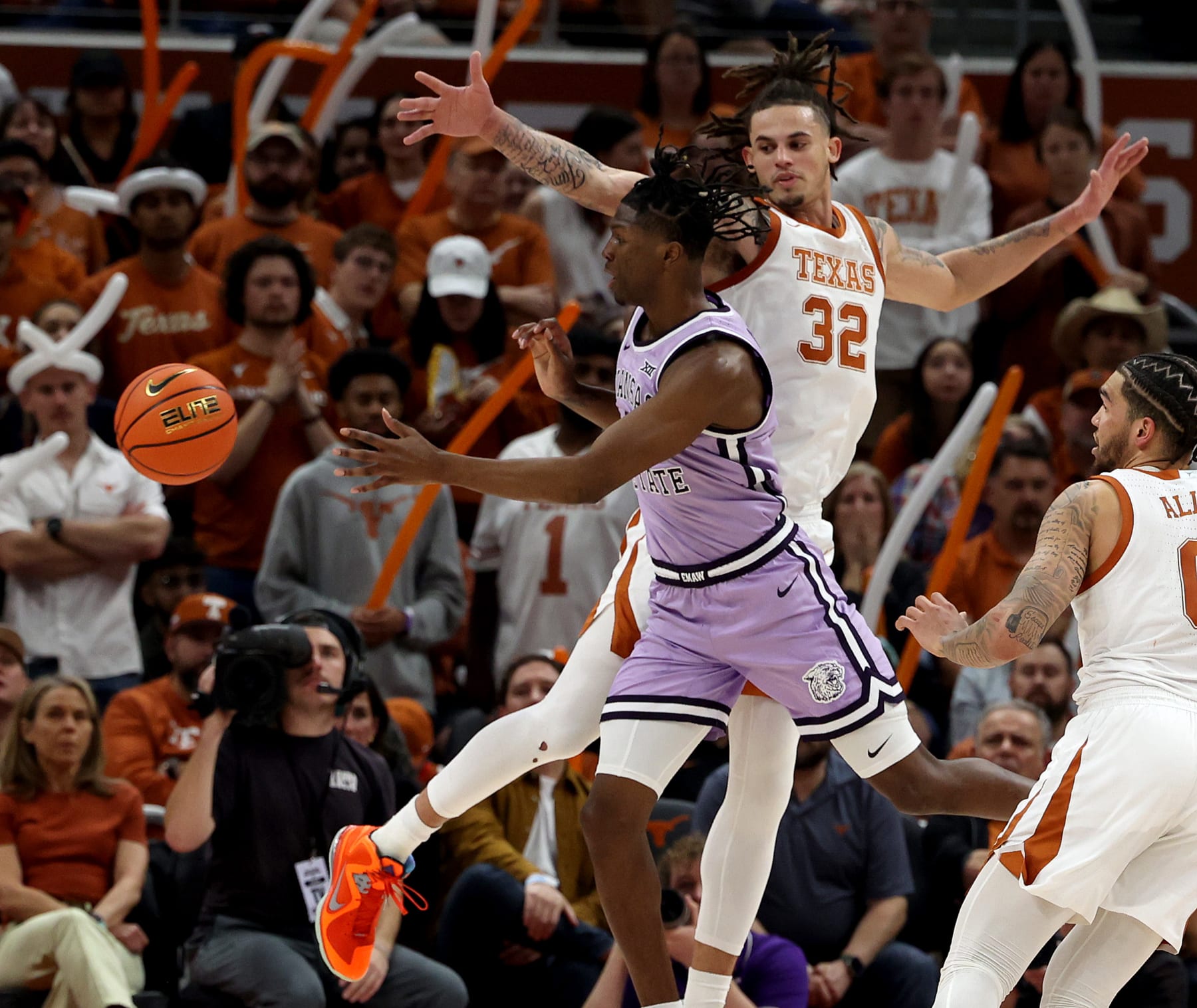 AUSTIN, TEXAS - JANUARY 03: Keyontae Johnson #11 of the Kansas State Wildcats passes the ball against Christian Bishop #32 of the Texas Longhorns between Kansas State Wildcats and the Texas Longhorns at Moody Center on January 03, 2023 in Austin, Texas. (Photo by Chris Covatta/Getty Images)