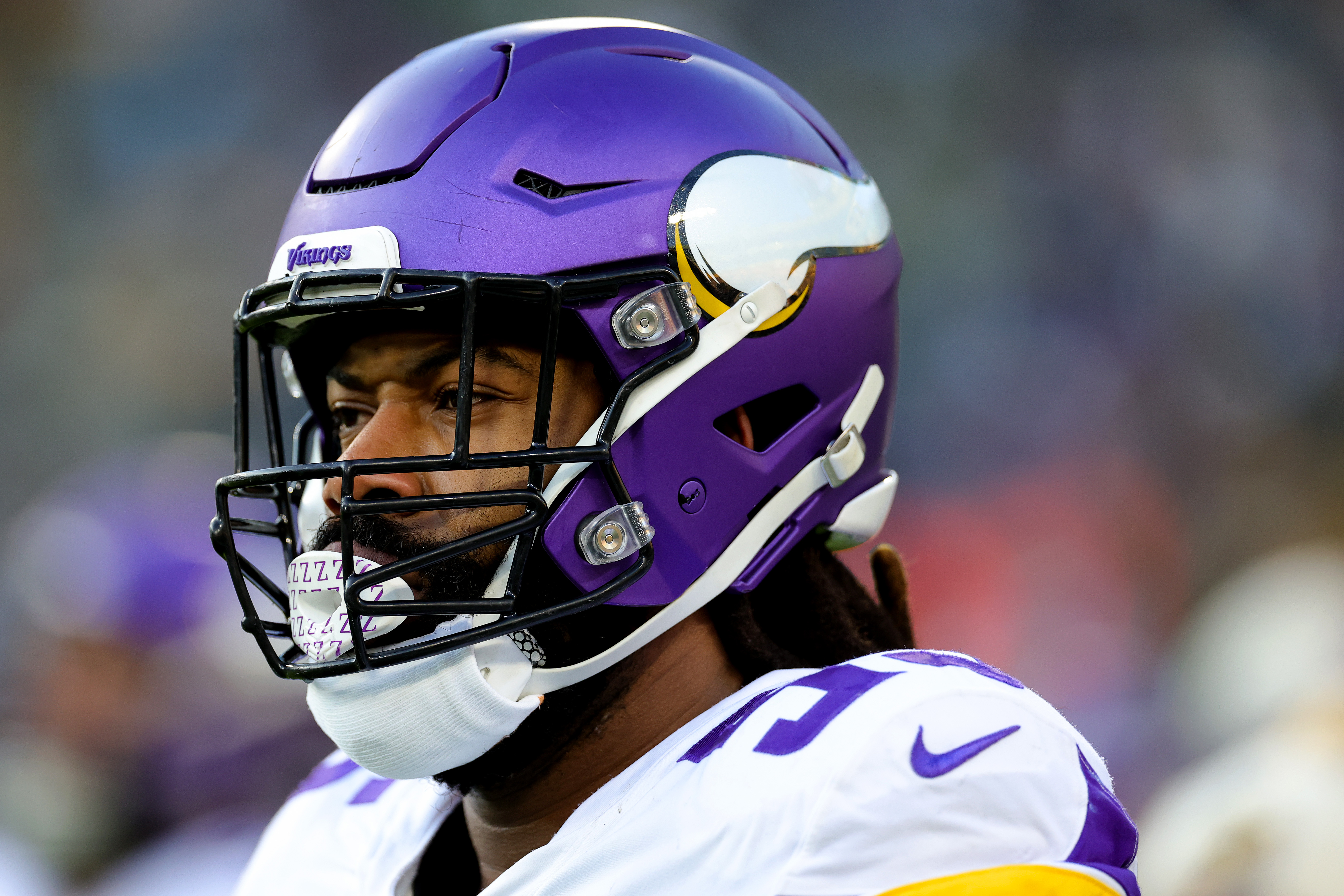 Minnesota Vikings fullback C.J. Ham (30) runs with the ball during the  first half of an NFL football game against the Chicago Bears, Sunday, Jan.  8, 2023, in Chicago. (AP Photo/Kamil Krzaczynski