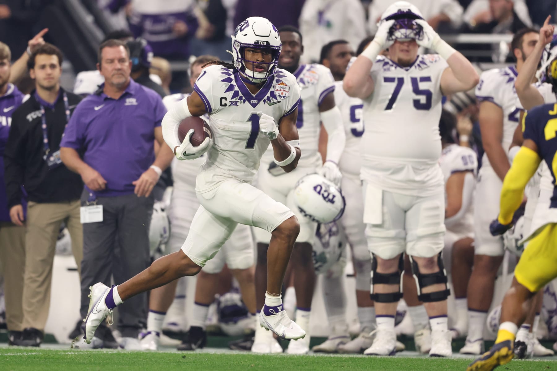 GLENDALE, ARIZONA - DECEMBER 31: Quentin Johnston #1 of the TCU Horned Frogs runs after catching a pass during the second quarter in the Vrbo Fiesta Bowl at State Farm Stadium on December 31, 2022 in Glendale, Arizona. (Photo by Christian Petersen/Getty Images)