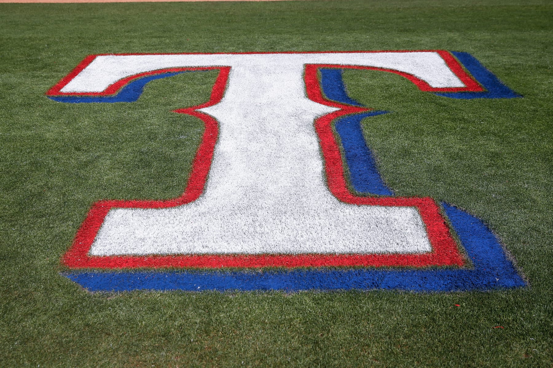 SURPRISE, AZ - MARCH 08:  The Texas Rangers logo on the field before the spring training MLB baseball game between the Los Angeles Dodgers and the Texas Rangers on March 8, 2020 at Surprise Stadium in Surprise, Arizona. (Photo by Kevin Abele/Icon Sportswire via Getty Images)