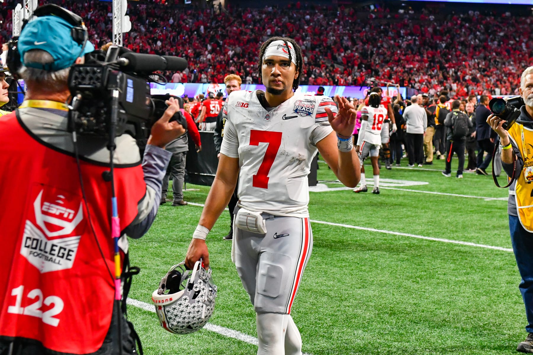 ATLANTA, GA DECEMBER 31: Ohio State quarterback C.J. Stroud (7) waves to the fans following the conclusion of the Chick-fil-A Peach Bowl semifinal college football playoff between the Ohio State Buckeyes and the Georgia Bulldogs on December 31st, 2022 at Mercedes-Benz Stadium in Atlanta, GA. (Photo by Rich von Biberstein/Icon Sportswire via Getty Images)