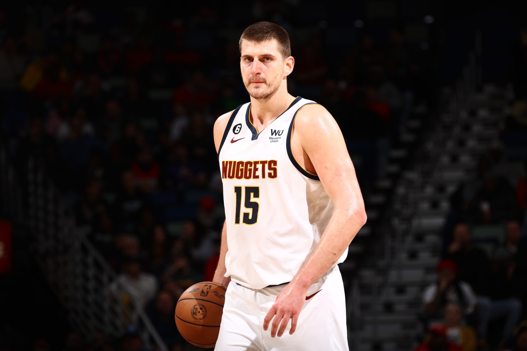 NEW ORLEANS, LA - JANUARY 24: Nikola Jokic #15 of the Denver Nuggets moves the ball during the game against the New Orleans Pelicans on January 24, 2023 at the Smoothie King Center in New Orleans, Louisiana. NOTE TO USER: User expressly acknowledges and agrees that, by downloading and or using this Photograph, user is consenting to the terms and conditions of the Getty Images License Agreement. Mandatory Copyright Notice: Copyright 2023 NBAE (Photo by Ned Dishman/NBAE via Getty Images)