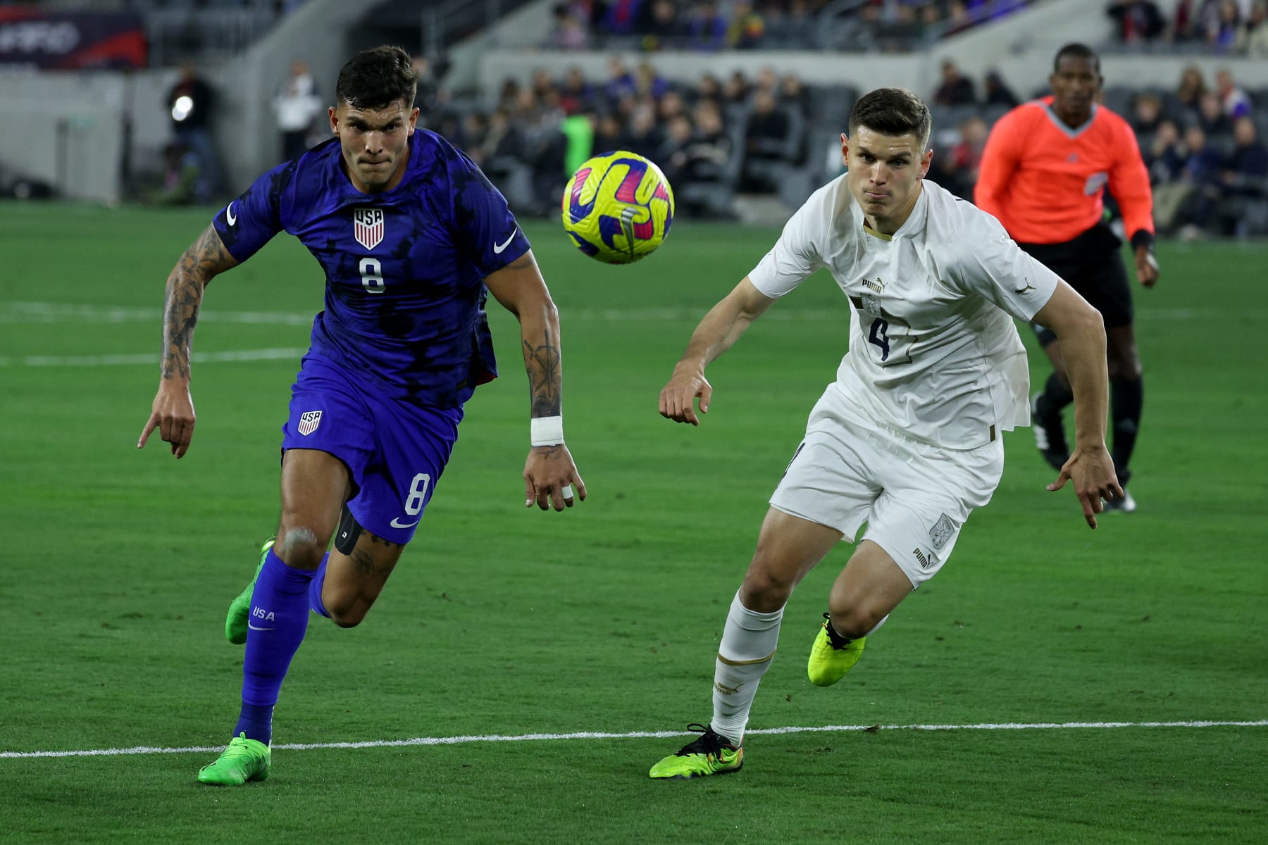 LOS ANGELES, CALIFORNIA - JANUARY 25: Brandon Vazquez #8 of the United States chases after the ball against Ranko Vesellnovic #4 of Serbia during the first half in the International Friendly match at BMO Stadium on January 25, 2023 in Los Angeles, California. (Photo by Harry How/Getty Images)