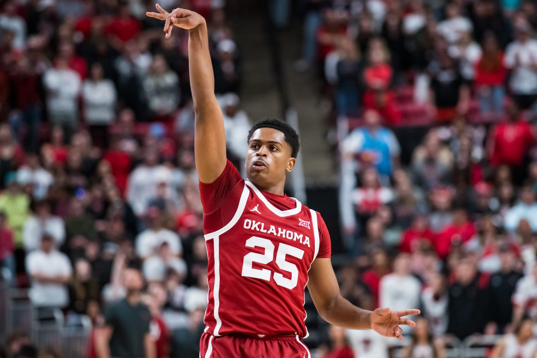 LUBBOCK, TEXAS - JANUARY 07: Guard Grant Sherfield #25 of the Oklahoma Sooners shoots the ball during the first half of the college basketball game against the Texas Tech Red Raiders at United Supermarkets Arena on January 07, 2023 in Lubbock, Texas. (Photo by John E. Moore III/Getty Images)