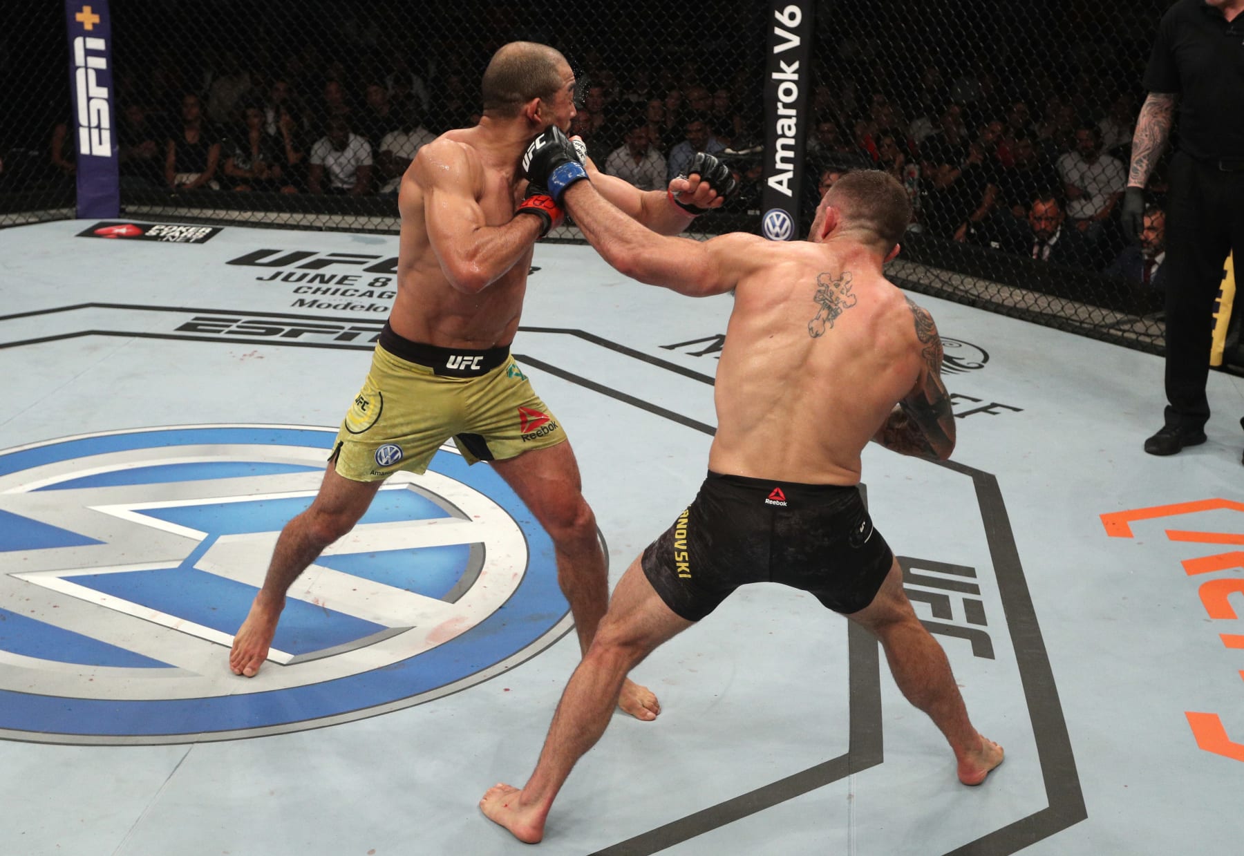 Alexander Volkanovski lands a left hand on Jose Aldo.