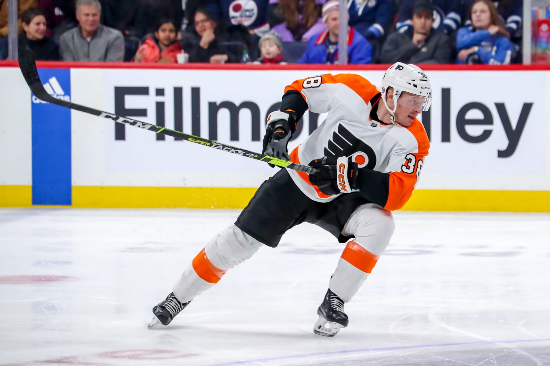 WINNIPEG, CANADA - JANUARY 28: Patrick Brown #38 of the Philadelphia Flyers follows the play up the ice during first period action against the Winnipeg Jets at the Canada Life Centre on January 28, 2023 in Winnipeg, Manitoba, Canada. The Flyers shutout the Jets 4-0. (Photo by Darcy Finley/NHLI via Getty Images)