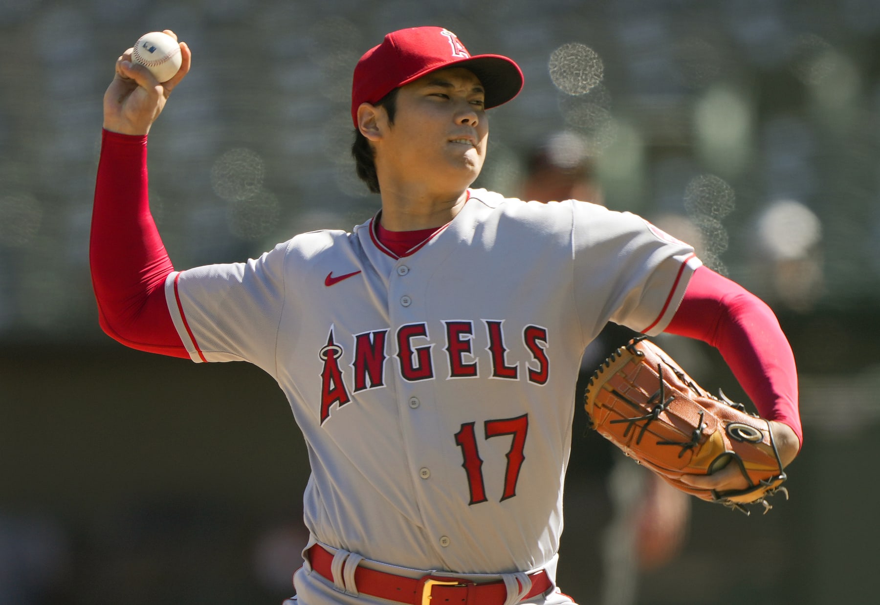 Los Angeles Angels' Shohei Ohtani runs his fingers through his hair during  the first inning of a baseball game against the Chicago Cubs Thursday, June  8, 2023, in Anaheim, Calif. (AP Photo/Mark