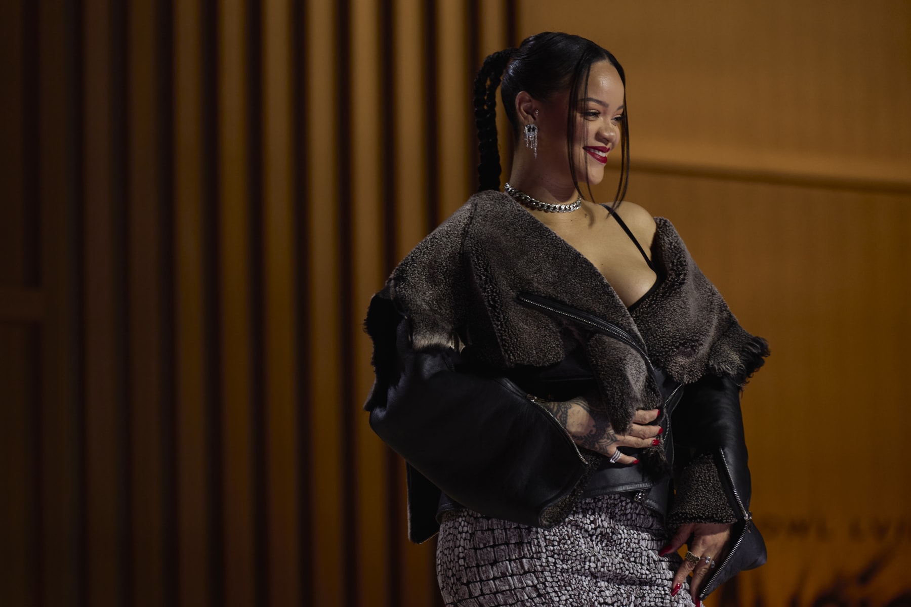 Rihanna Teases Super Bowl Halftime Show 2023 in Dramatic Coat & Braids – WWD