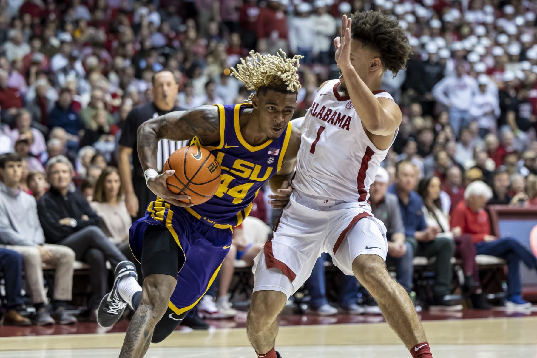 LSU guard Adam Miller (44) works inside against Alabama guard Mark Sears (1) during the first half of an NCAA college basketball game, Saturday, Jan. 14, 2023, in Tuscaloosa, Ala. (AP Photo/Vasha Hunt) LSU guard Adam Miller (44) works inside against Alabama guard Mark Sears (1) during the first half of an NCAA college basketball game, Saturday, Jan. 14, 2023, in Tuscaloosa, Ala. (AP Photo/Vasha Hunt)