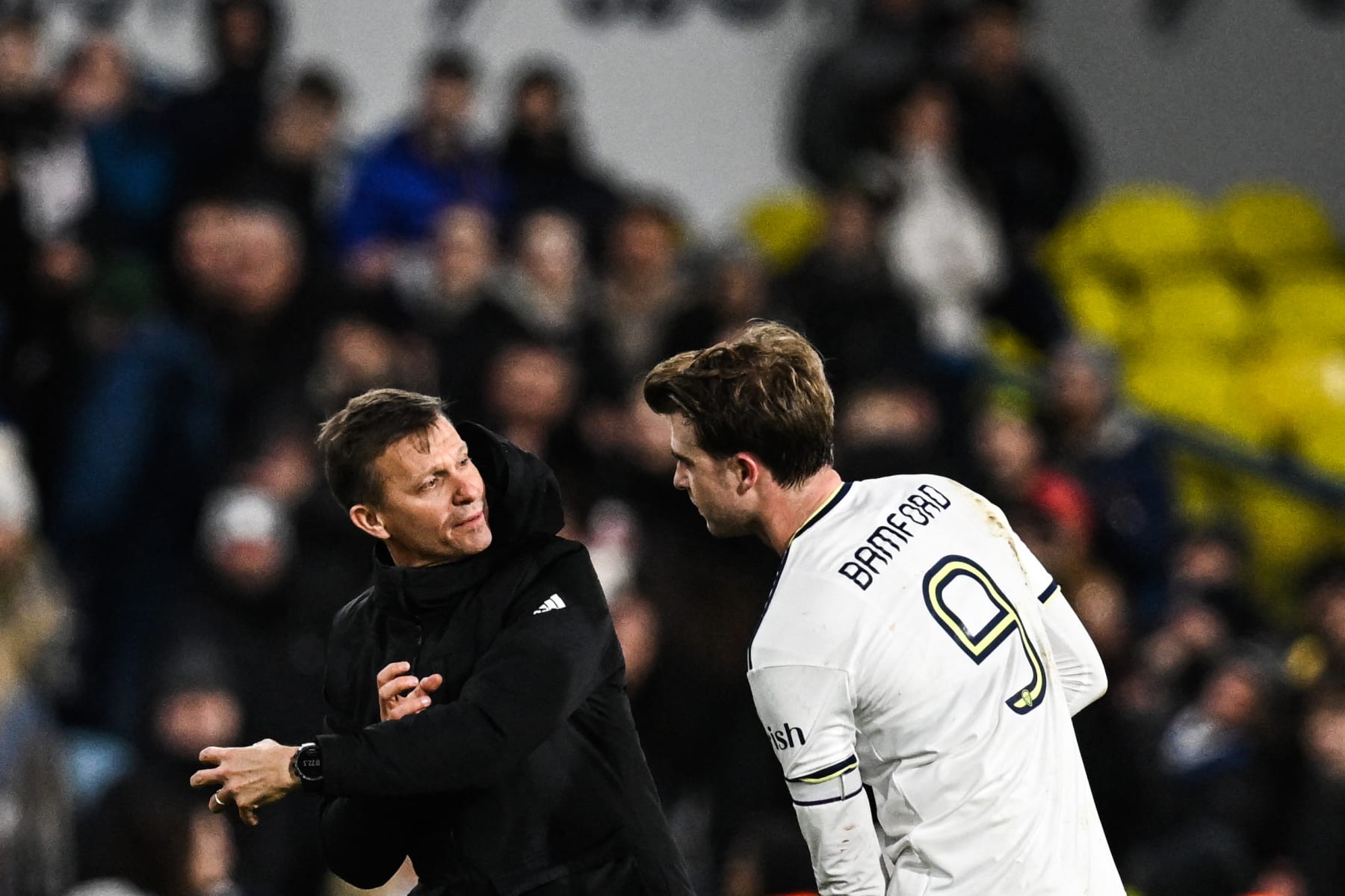Leeds United's US head coach Jesse Marsch (L) speaks with Leeds United's English striker Patrick Bamford at the end of the English FA Cup third round football match between Leeds United and Cardiff City at Elland Road in Leeds, northern England on January 18, 2023. - Leeds wins 5 - 2 against Cardiff. - RESTRICTED TO EDITORIAL USE. No use with unauthorized audio, video, data, fixture lists, club/league logos or 'live' services. Online in-match use limited to 120 images. An additional 40 images may be used in extra time. No video emulation. Social media in-match use limited to 120 images. An additional 40 images may be used in extra time. No use in betting publications, games or single club/league/player publications. (Photo by Paul ELLIS / AFP) / RESTRICTED TO EDITORIAL USE. No use with unauthorized audio, video, data, fixture lists, club/league logos or 'live' services. Online in-match use limited to 120 images. An additional 40 images may be used in extra time. No video emulation. Social media in-match use limited to 120 images. An additional 40 images may be used in extra time. No use in betting publications, games or single club/league/player publications. / RESTRICTED TO EDITORIAL USE. No use with unauthorized audio, video, data, fixture lists, club/league logos or 'live' services. Online in-match use limited to 120 images. An additional 40 images may be used in extra time. No video emulation. Social media in-match use limited to 120 images. An additional 40 images may be used in extra time. No use in betting publications, games or single club/league/player publications. (Photo by PAUL ELLIS/AFP via Getty Images)