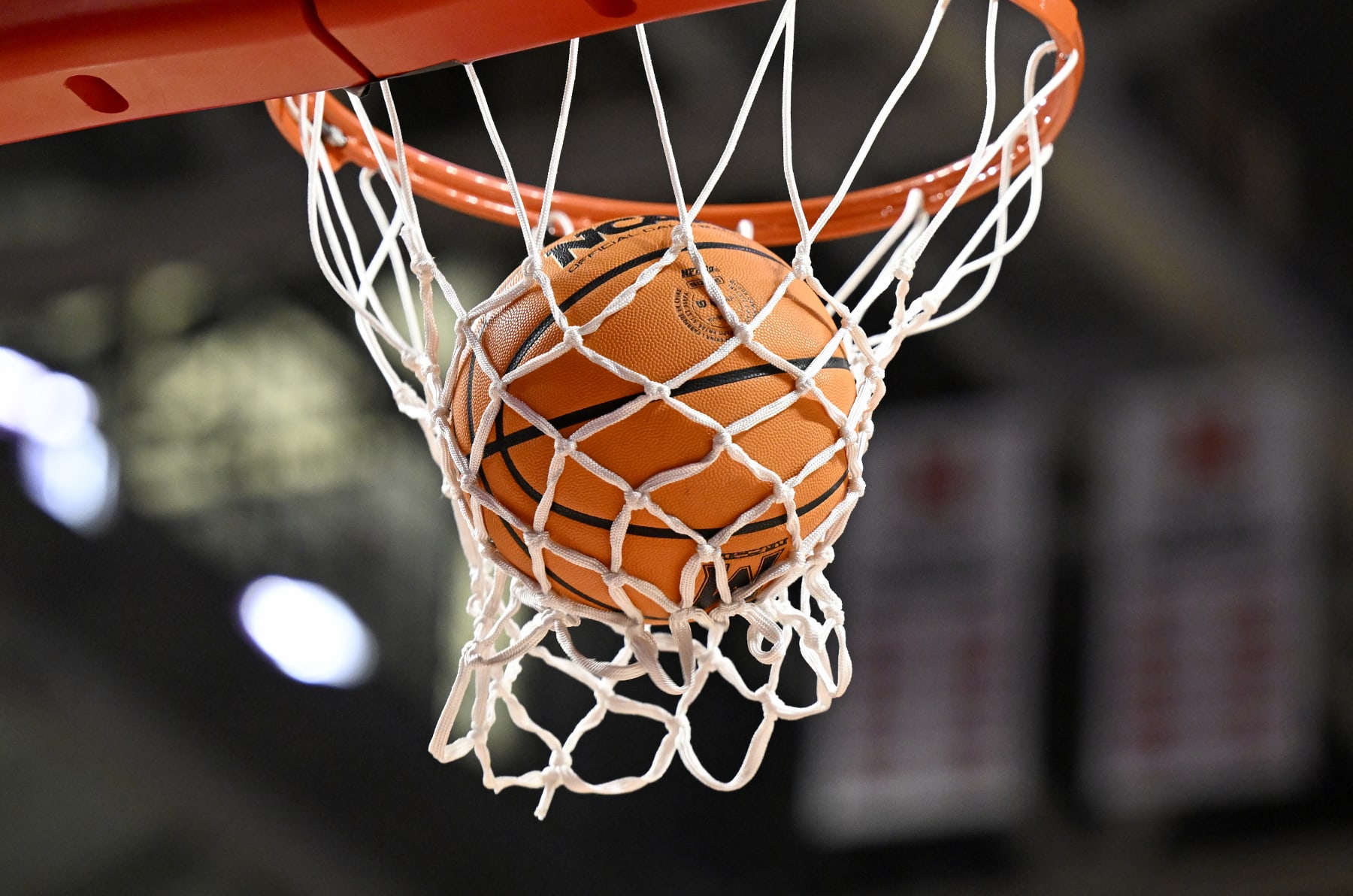 COLLEGE PARK, MARYLAND - FEBRUARY 05: A basketball goes through the hoop during the game between the Maryland Terrapins and the Ohio State Buckeyes at Xfinity Center on February 05, 2023 in College Park, Maryland. (Photo by G Fiume/Getty Images)