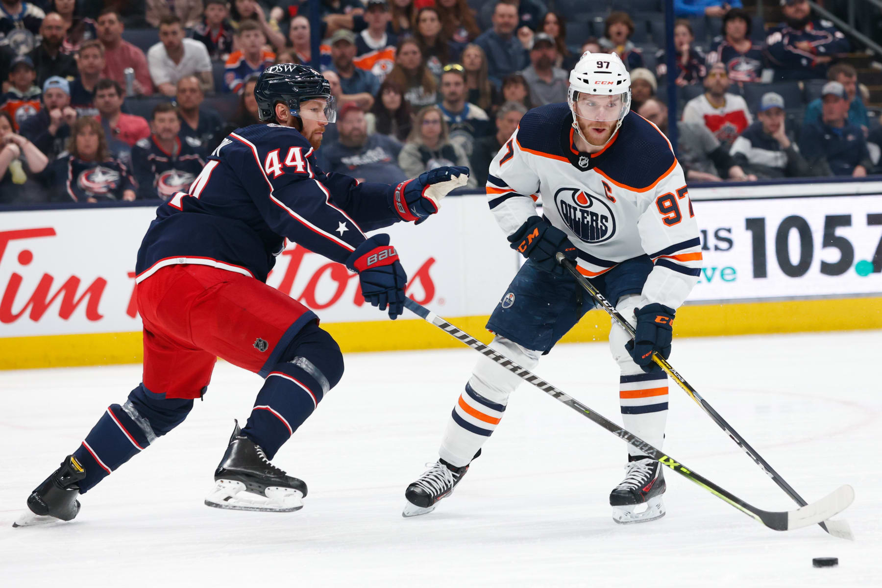 COLUMBUS, OH - APRIL 24: Edmonton Oilers center Connor McDavid (97) covered by Columbus Blue Jackets defenceman Vladislav Gavrikov (44) during the game between the Columbus Blue Jackets and the Edmonton Oilers on April 24, 2022, at Nationwide Arena in Columbus, Ohio. (Photo by Graham Stokes/Icon Sportswire via Getty Images)