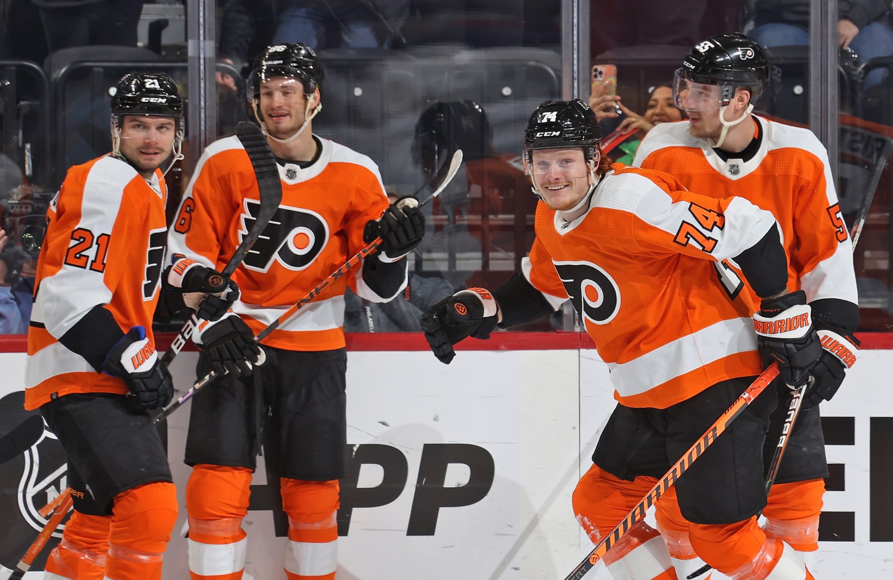 PHILADELPHIA, PENNSYLVANIA - FEBRUARY 12: Owen Tippett #74 of the Philadelphia Flyers celebrates his first period power-play goal against the Seattle Kraken with Scott Laughton #21, Joel Farabee #86, adn Rasmus Ristolainen #55 at the Wells Fargo Center on February 12, 2023 in Philadelphia, Pennsylvania. (Photo by Len Redkoles/NHLI via Getty Images)