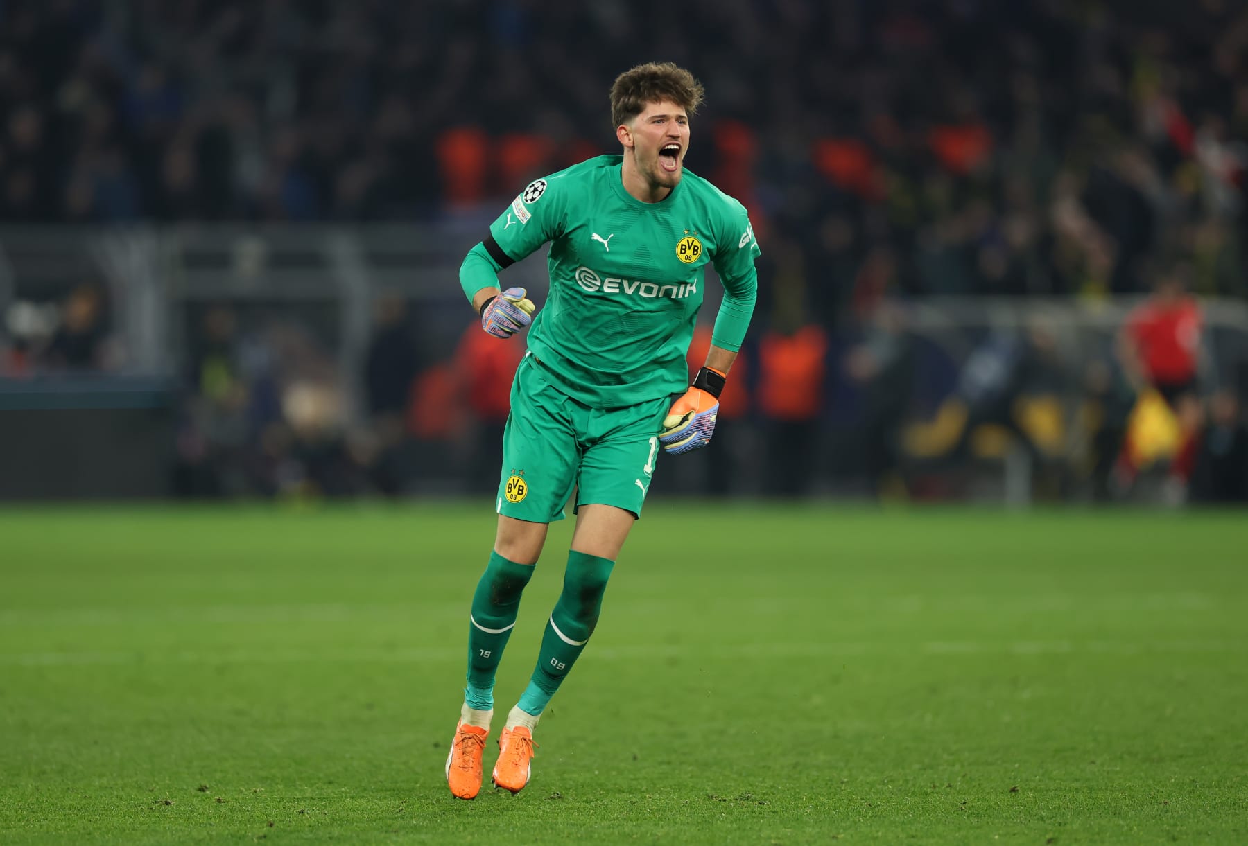 DORTMUND, GERMANY - FEBRUARY 15: Gregor Kobel of Borussia Dortmund celebrates after the team's first goal during the UEFA Champions League round of 16 leg one match between Borussia Dortmund and Chelsea FC at Signal Iduna Park on February 15, 2023 in Dortmund, Germany. (Photo by Lars Baron/Getty Images)