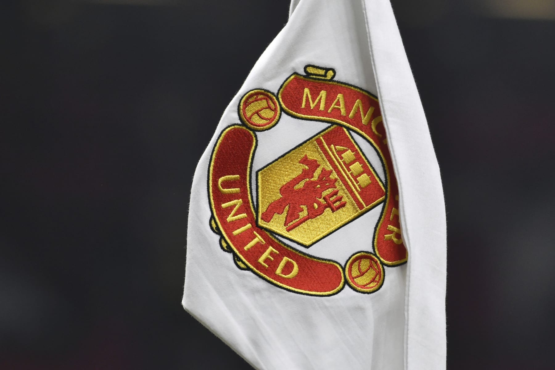A corner flag showing the logo of Manchester United is seen ahead of the English FA Cup 4th round soccer match between Manchester United and Reading at Old Trafford in Manchester, England, Saturday, Jan. 28, 2023. (AP Photo/Rui Vieira)