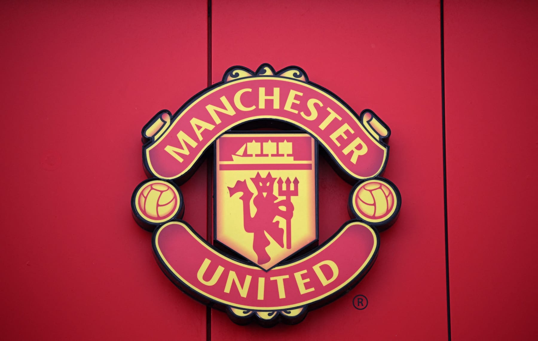 A Manchester United logo is pictured outside of Old Trafford stadium, home ground of Manchester United football team, in Manchester, northern England, on November 23, 2022. - Manchester United's owners said Tuesday they were ready to sell the club after it was earlier confirmed star player Cristiano Ronaldo was leaving the Premier League giants. Weeks of turbulence at Old Trafford appeared to have come to an end when the club announced Ronaldo was leaving with "immediate effect". (Photo by Oli SCARFF / AFP) (Photo by OLI SCARFF/AFP via Getty Images)