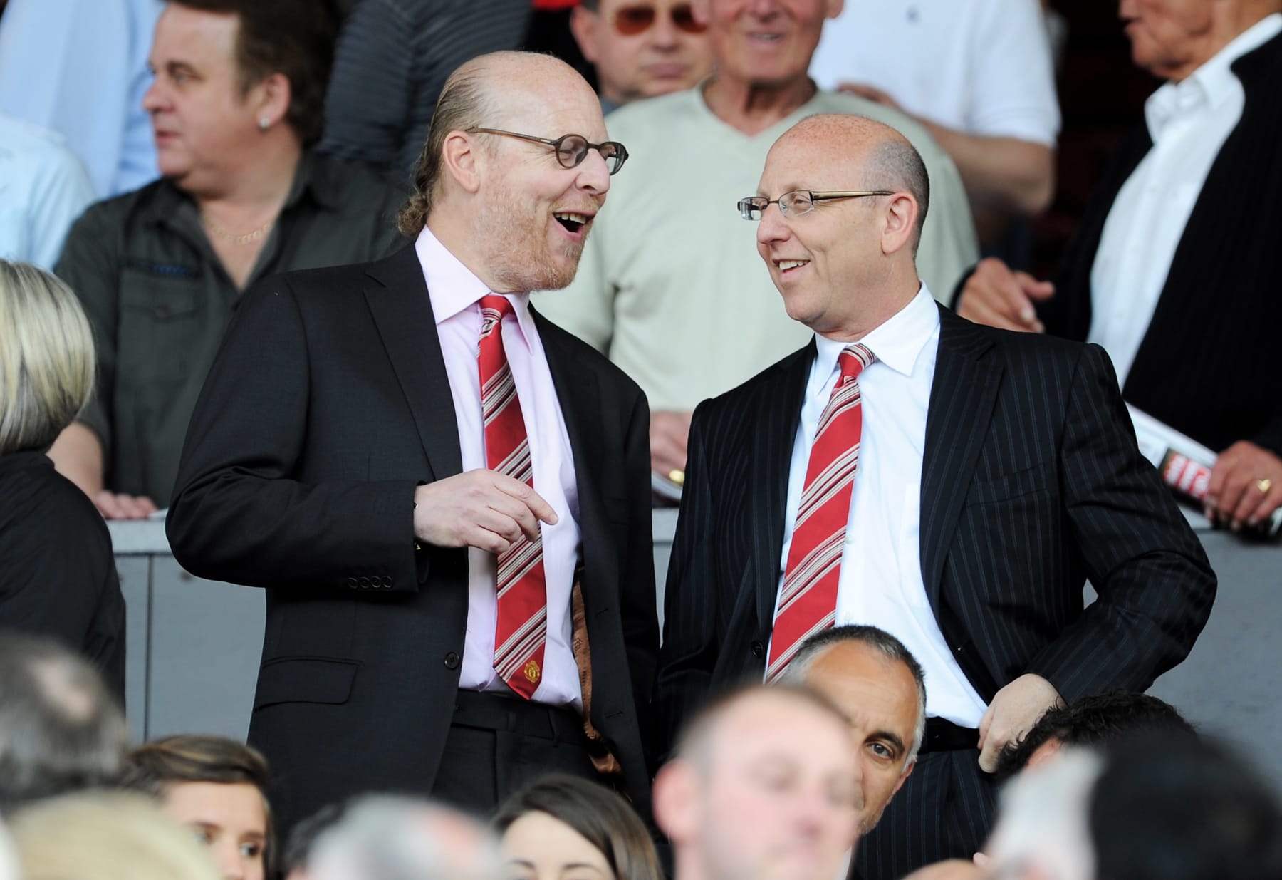MANCHESTER, ENGLAND - APRIL 09: Manchester United Co-Chairmen Joel Glazer (R) and Avram Glazer talk during the Barclays Premier League match between Manchester United and Fulham at Old Trafford on April 9, 2011 in Manchester, England.  (Photo by Michael Regan/Getty Images)