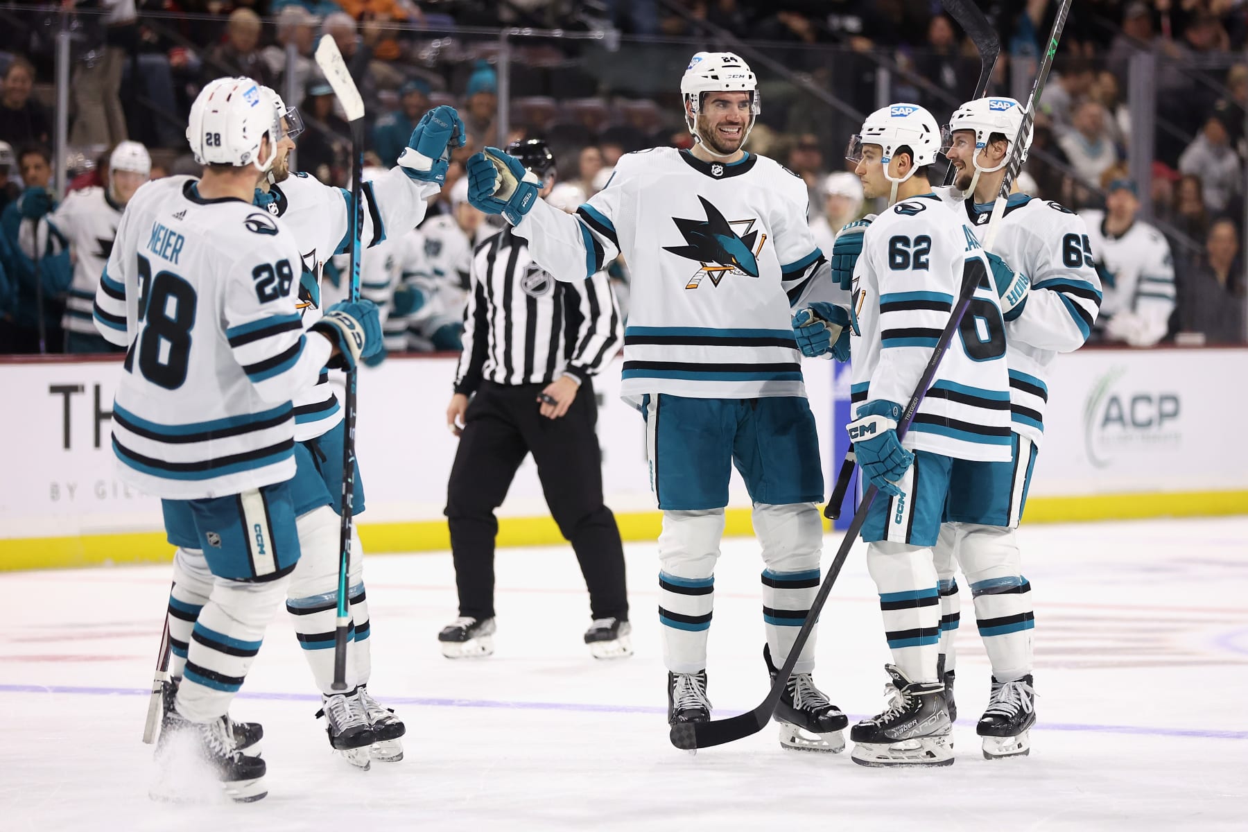 TEMPE, ARIZONA - JANUARY 10: Jaycob Megna #24 of the San Jose Sharks is congratulated by Timo Meier #28, Tomas Hertl #48, Kevin Labanc #62 and Erik Karlsson #65 after scoring a goal against the Arizona Coyotes during the third period of the NHL game at Mullett Arena on January 10, 2023 in Tempe, Arizona. The Sharks defeated the Coyotes 4-2. (Photo by Christian Petersen/Getty Images) TEMPE, ARIZONA - JANUARY 10: Jaycob Megna #24 of the San Jose Sharks is congratulated by Timo Meier #28, Tomas Hertl #48, Kevin Labanc #62 and Erik Karlsson #65 after scoring a goal against the Arizona Coyotes during the third period of the NHL game at Mullett Arena on January 10, 2023 in Tempe, Arizona. The Sharks defeated the Coyotes 4-2. (Photo by Christian Petersen/Getty Images)
