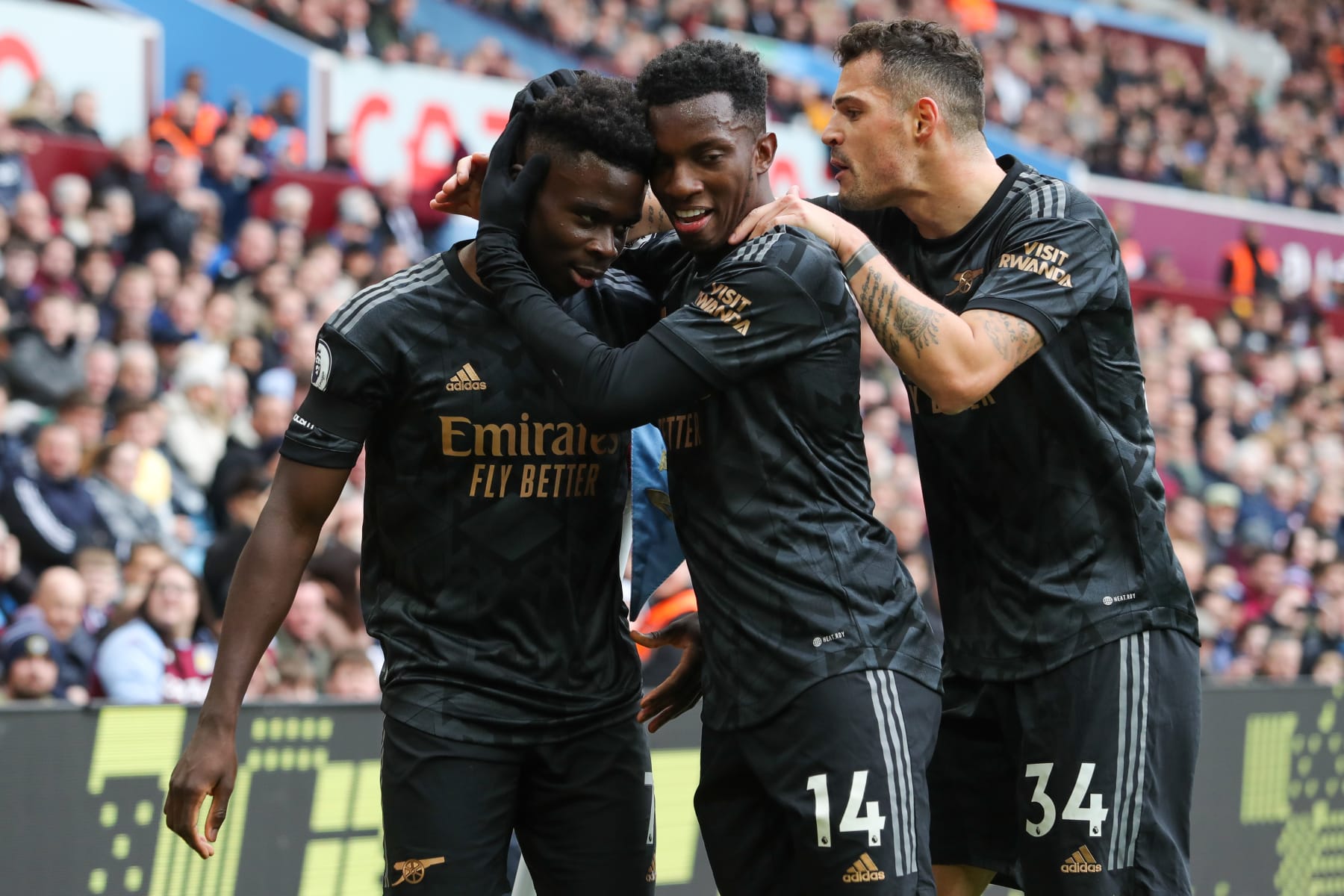 BIRMINGHAM, ENGLAND - FEBRUARY 18: Bukayo Saka of Arsenal celebrates with teammates after scoring his side's first goal during the Premier League match between Aston Villa and Arsenal FC at Villa Park on February 18, 2023 in Birmingham, England. (Photo by James Gill - Danehouse/Getty Images)