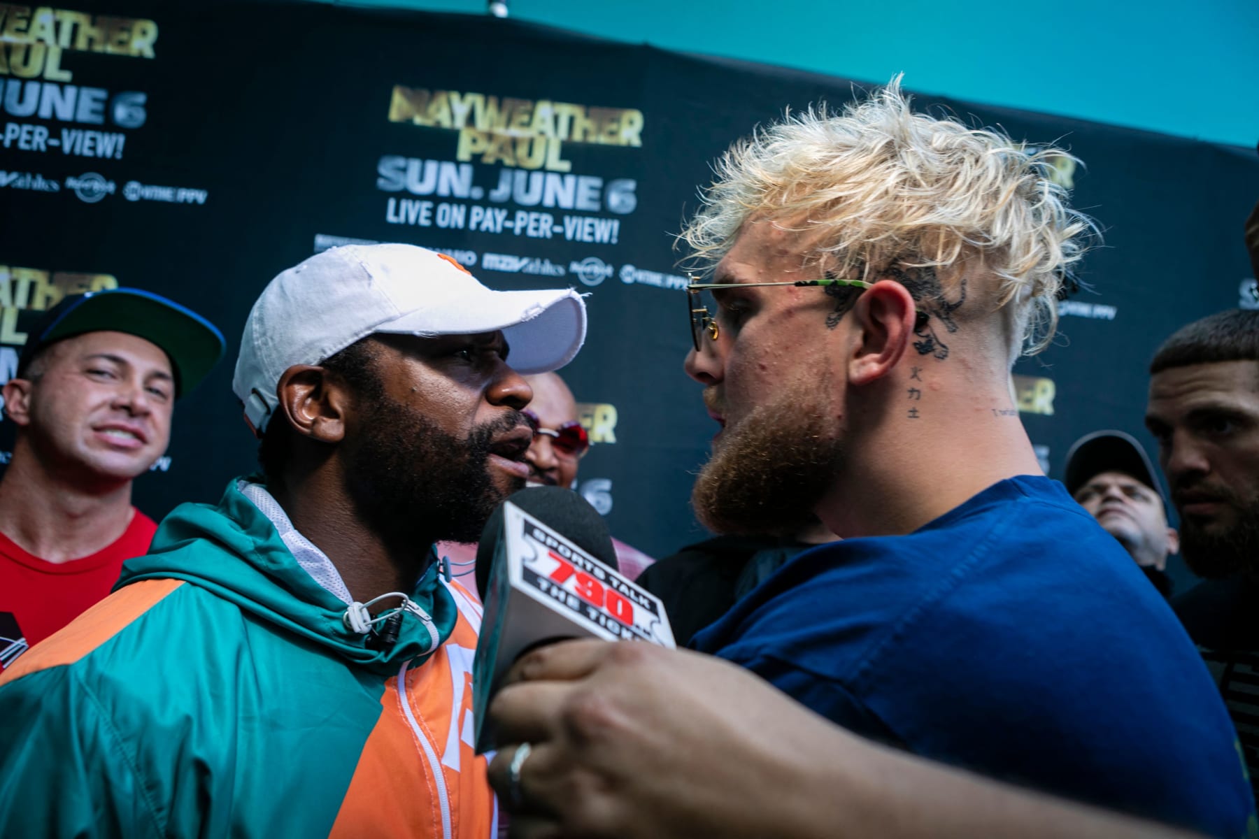 TOPSHOT - Floyd Mayweather (L) and Jake Paul pose during a press conference at Hard Rock Stadium, in Miami Gardens, Florida, on May 6, 2021. - Former world welterweight king Floyd Mayweather said May 4,2021 he will face off against YouTube personality Logan Paul in an exhibition bout at Miami's Hard Rock Stadium on June 6, 2021. (Photo by Eva Marie UZCATEGUI / AFP) (Photo by EVA MARIE UZCATEGUI/AFP via Getty Images)