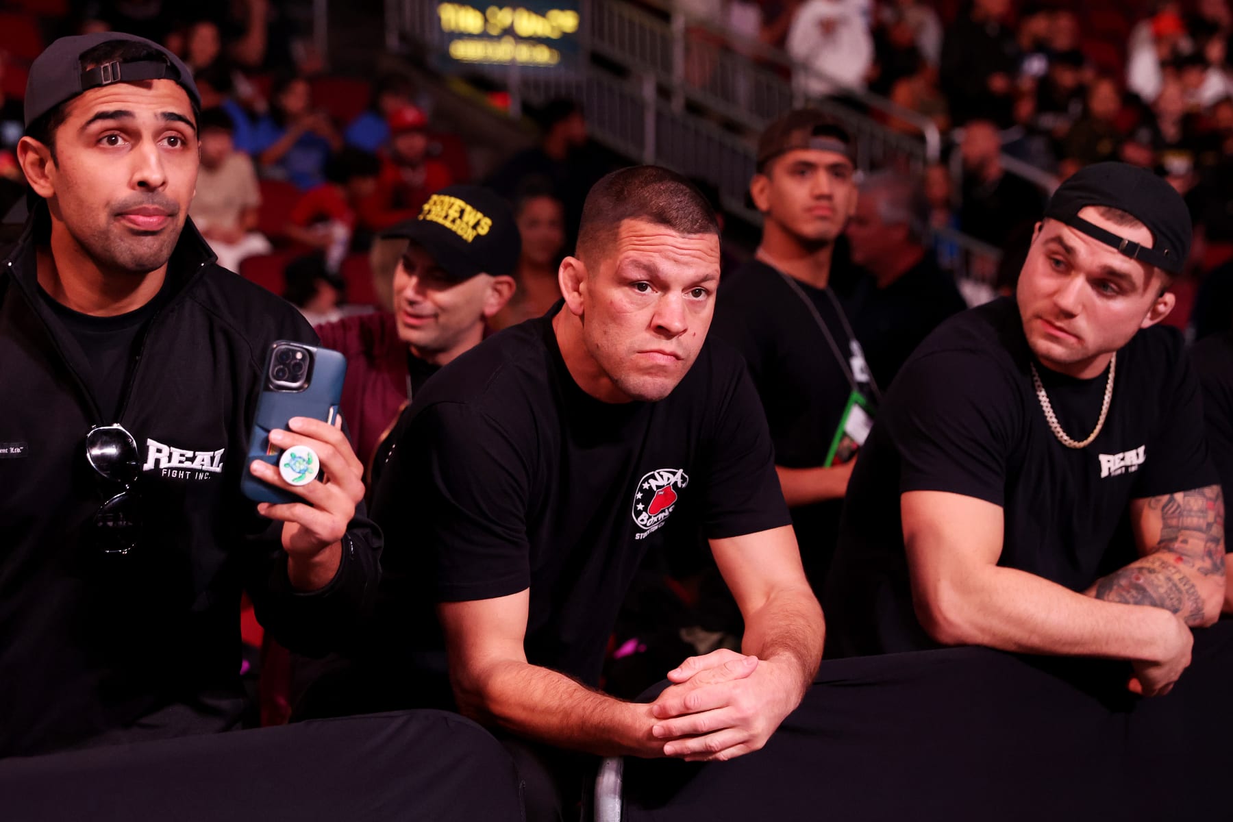 GLENDALE, ARIZONA - OCTOBER 29: MMA fighter Nate Diaz (C) attends the Jake Paul and Anderson Silva fight at Desert Diamond Arena on October 29, 2022 in Glendale, Arizona. (Photo by Christian Petersen/Getty Images)