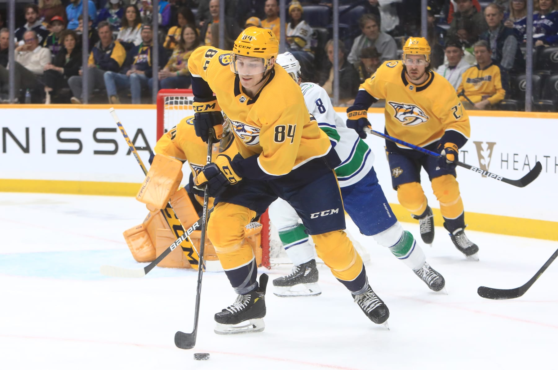 NASHVILLE, TN - FEBRUARY 21: Nashville Predators left wing Tanner Jeannot (84) skates with the puck during the NHL game between the Nashville Predators and Vancouver Canucks, held on February 21, 2023, at Bridgestone Arena in Nashville, Tennessee. (Photo by Danny Murphy/Icon Sportswire via Getty Images)