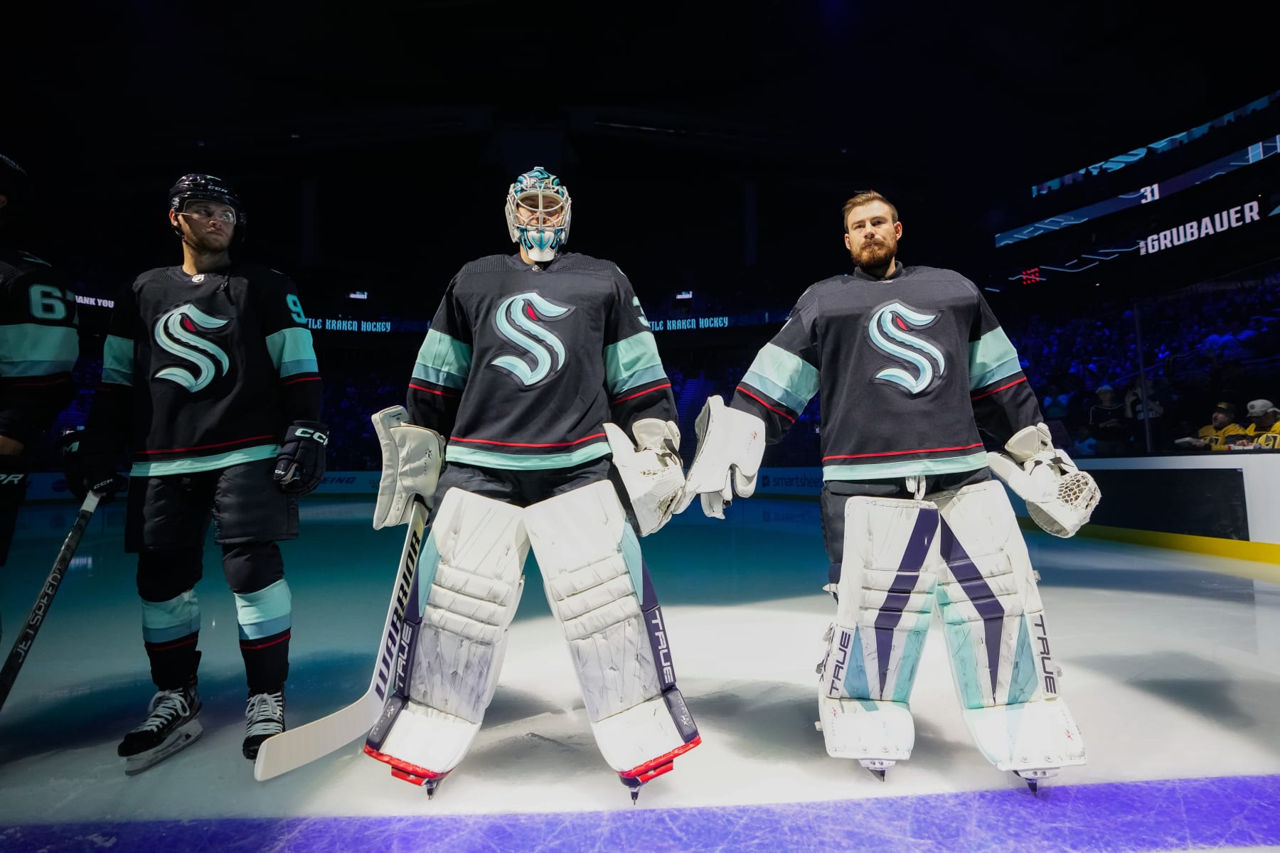 SEATTLE, WASHINGTON - OCTOBER 15: Goaltenders Martin Jones #30 and Philipp Grubauer #31 of the Seattle Kraken stand at the blue line during introductions before a game against the Vegas Golden Knights at Climate Pledge Arena on October 15, 2022 in Seattle, Washington. (Photo by Christopher Mast/NHI via Getty Images)