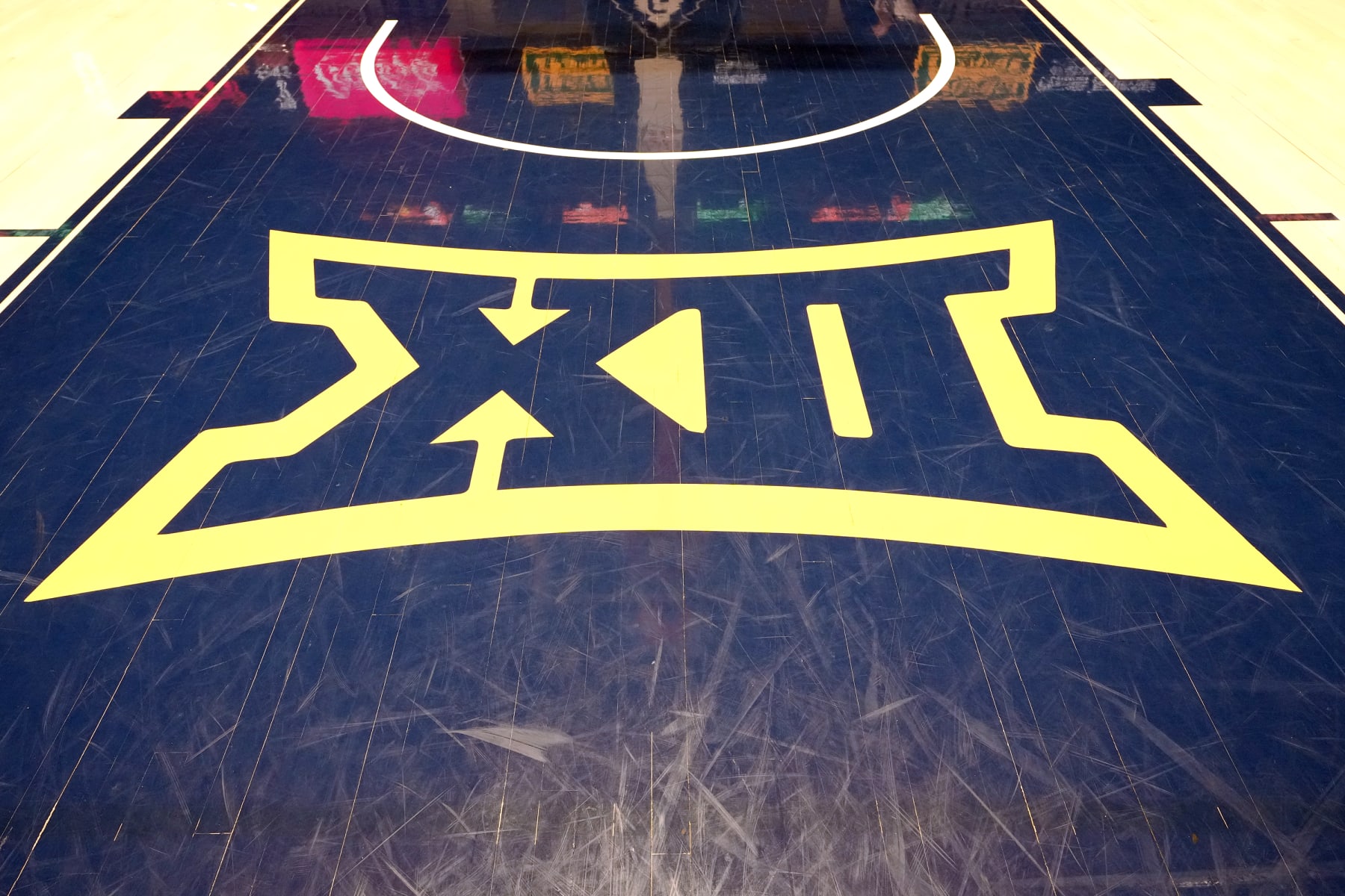 MORGANTOWN, WEST VIRGINIA - FEBRUARY 20: The Big XII logo is displayed on the floor before a college basketball game between the West Virginia Mountaineers and the Oklahoma State Cowboys at the WVU Coliseum on February 20, 2023 in Morgantown, West Virginia. (Photo by Mitchell Layton/Getty Images)