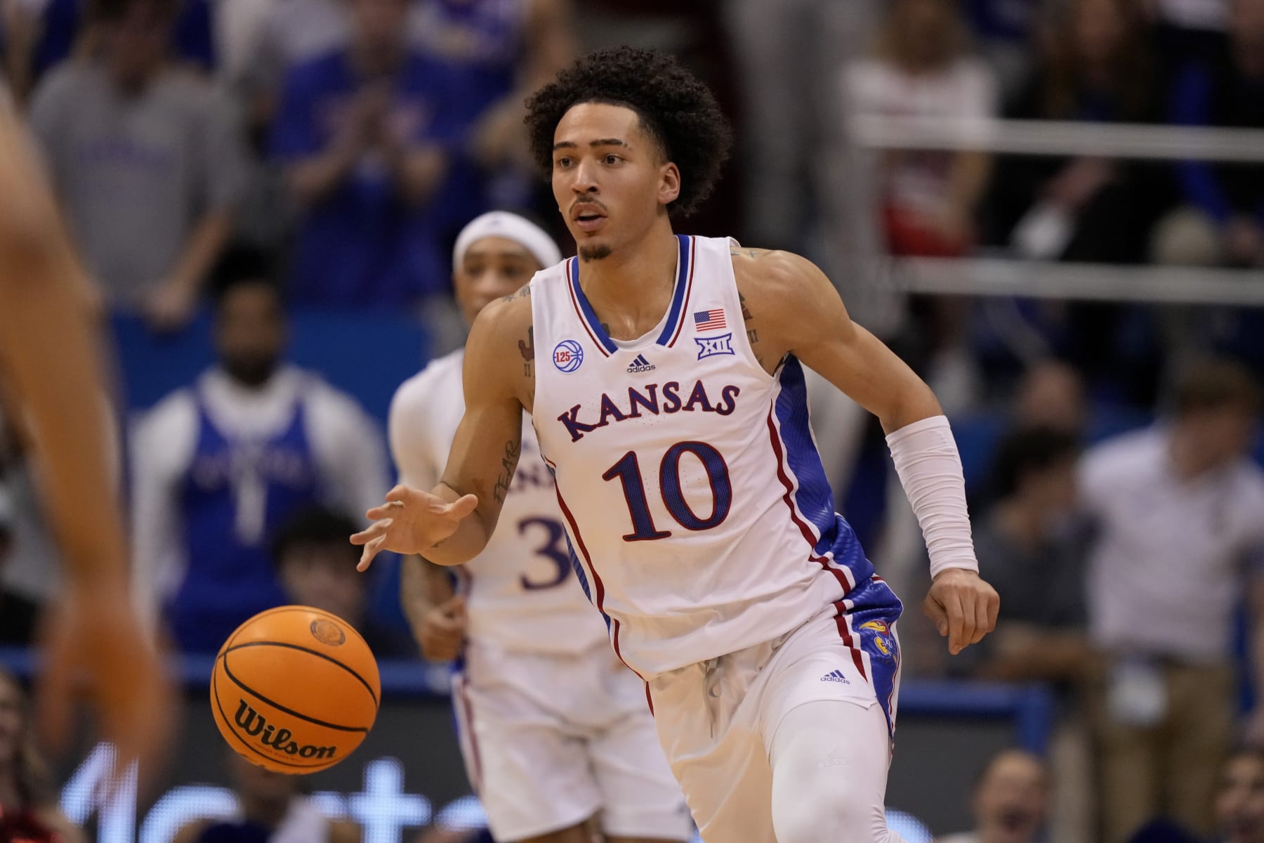Kansas forward Jalen Wilson drives during the first half of an NCAA college basketball game against Texas Monday, Feb. 6, 2023, in Lawrence, Kan. (AP Photo/Charlie Riedel)