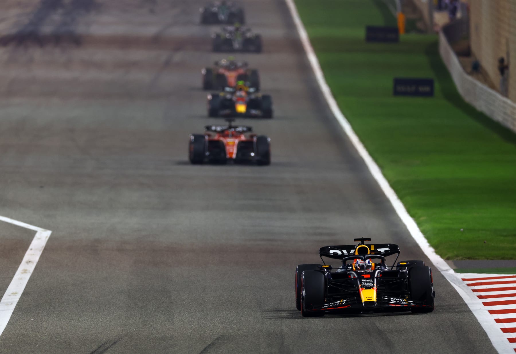 BAHRAIN, BAHRAIN - MARCH 05: Max Verstappen of the Netherlands driving the (1) Oracle Red Bull Racing RB19 leads Charles Leclerc of Monaco driving the (16) Ferrari SF-23 during the F1 Grand Prix of Bahrain at Bahrain International Circuit on March 05, 2023 in Bahrain, Bahrain. (Photo by Mark Thompson/Getty Images)