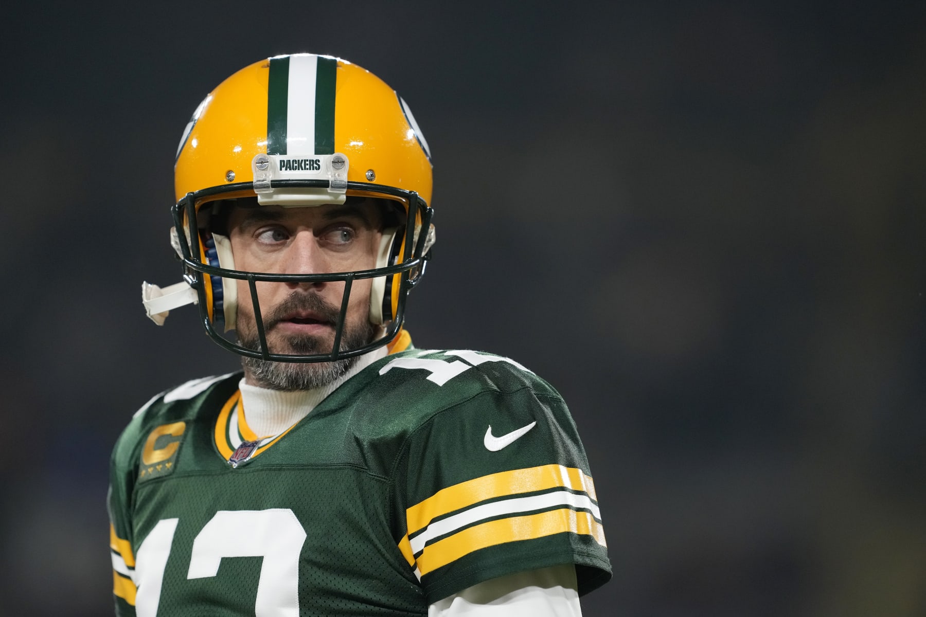 October 24, 2021: Green Bay Packers quarterback Aaron Rodgers #12 warms up  before the NFL football game between the Washington Football Team and the  Green Bay Packers at Lambeau Field in Green