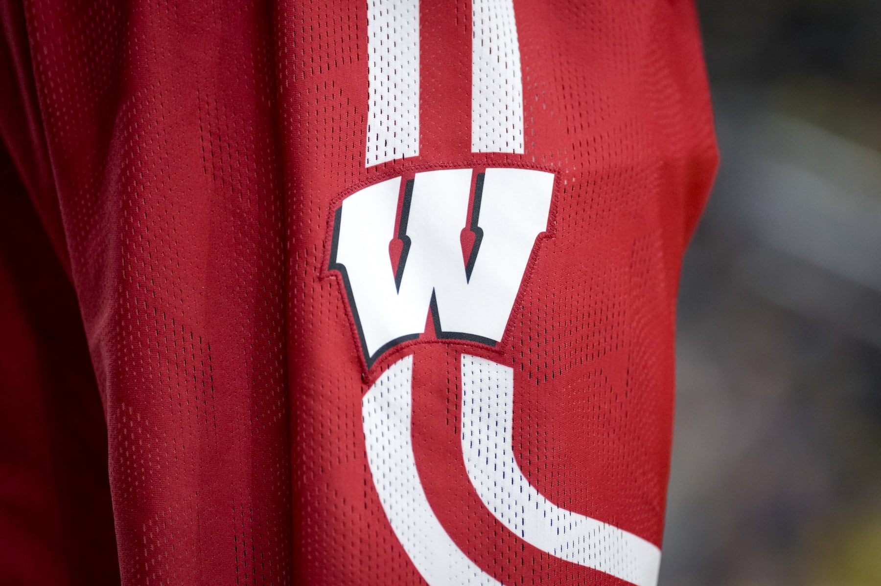 ANN ARBOR, MICHIGAN - FEBRUARY 26: A Wisconsin Badgers logo is pictured on a Wisconsin Badgers uniform during the game against the Michigan Wolverines at Crisler Arena on February 26, 2023 in Ann Arbor, Michigan. (Photo by Nic Antaya/Getty Images)