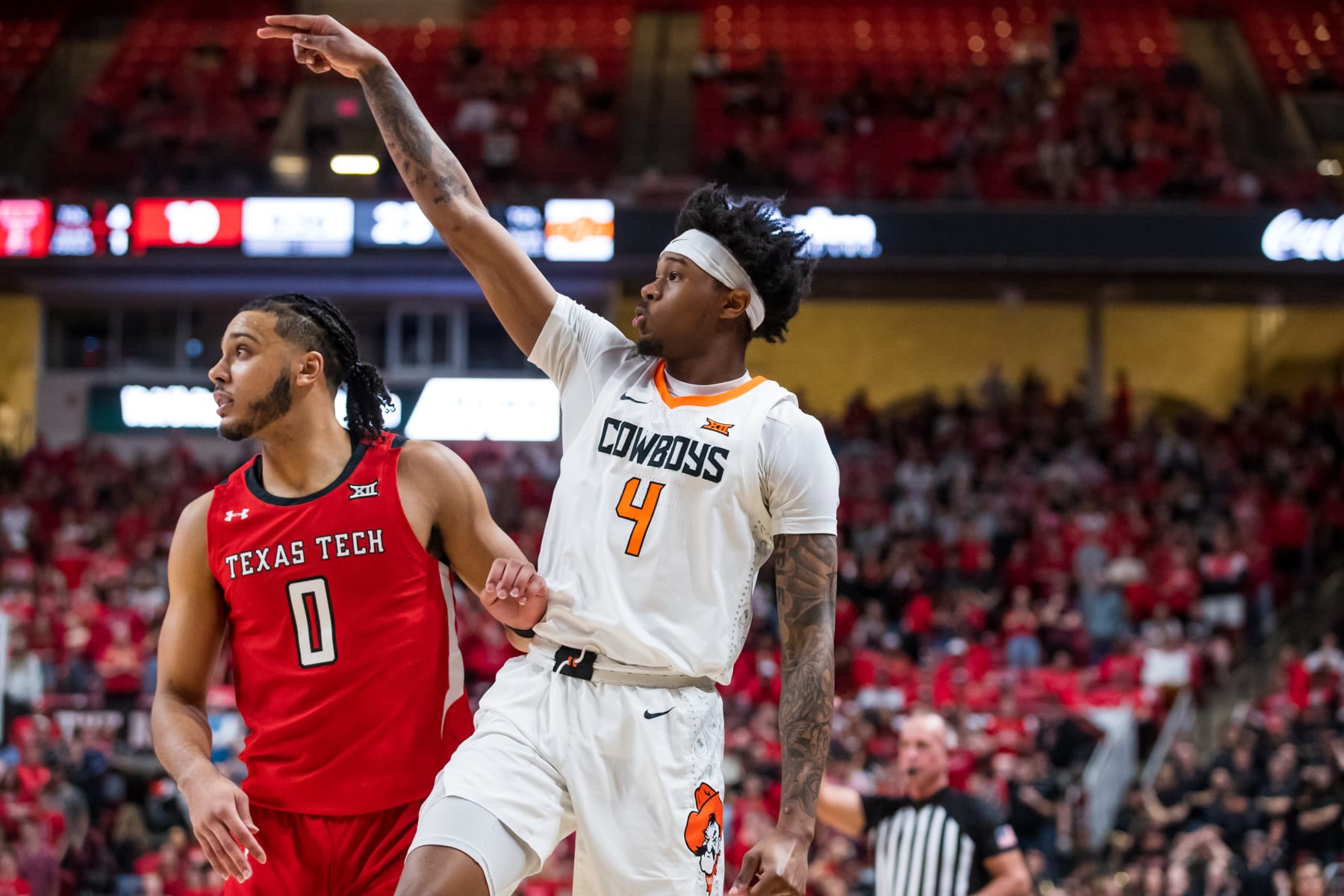 LUBBOCK, TEXAS - MARCH 04: Guard Woody Newton #4 of the Oklahoma State Cowboys shoots the ball during the first half of the college basketball game against the Texas Tech Red Raiders at United Supermarkets Arena on March 04, 2023 in Lubbock, Texas. (Photo by John E. Moore III/Getty Images)