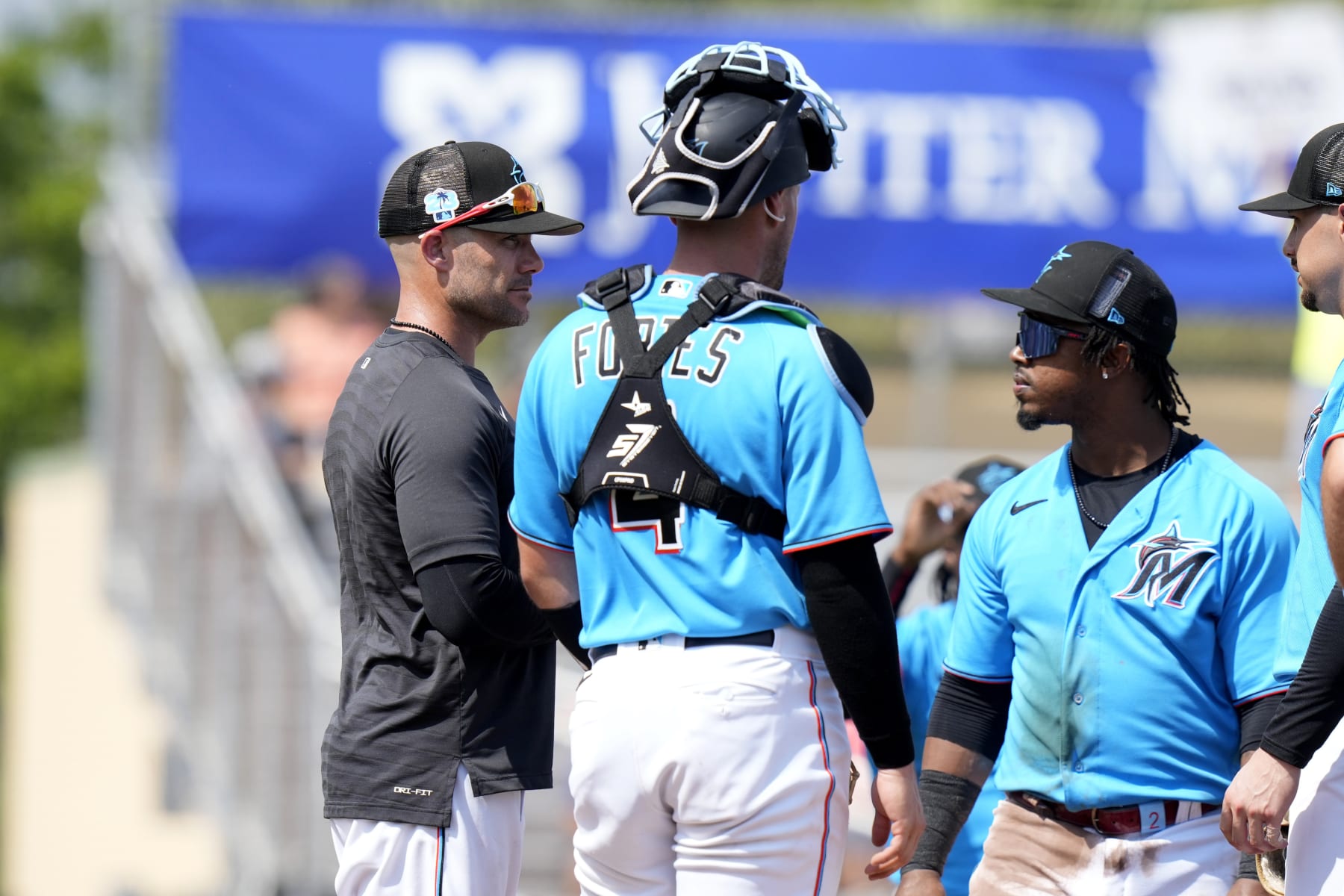Luis Arraez of the Miami Marlins, congratulates Johnny Cueto of the News  Photo - Getty Images