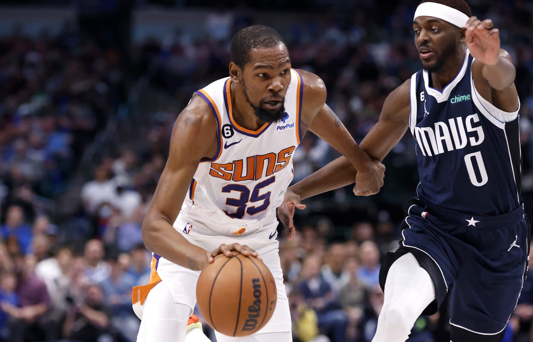 DALLAS, TX - MARCH 5: Kevin Durant #35 of the Phoenix Suns goes to the basket as Justin Holiday #0 of the Dallas Mavericks defends in the second half of the game at American Airlines Center on March 5, 2023 in Dallas, Texas. The Suns won 130-126. NOTE TO USER: User expressly acknowledges and agrees that, by downloading and or using this photograph, User is consenting to the terms and conditions of the Getty Images License Agreement. (Photo by Ron Jenkins/Getty Images) DALLAS, TX - MARCH 5: Kevin Durant #35 of the Phoenix Suns goes to the basket as Justin Holiday #0 of the Dallas Mavericks defends in the second half of the game at American Airlines Center on March 5, 2023 in Dallas, Texas. The Suns won 130-126. NOTE TO USER: User expressly acknowledges and agrees that, by downloading and or using this photograph, User is consenting to the terms and conditions of the Getty Images License Agreement. (Photo by Ron Jenkins/Getty Images)