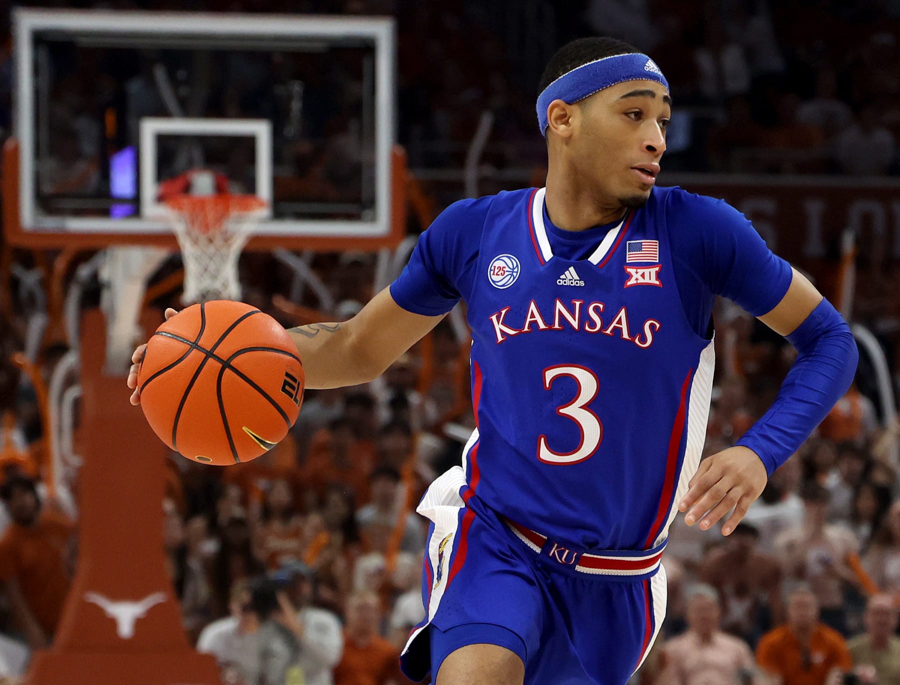 AUSTIN, TEXAS - MARCH 04: Dajuan Harris Jr. #3 of the Kansas Jayhawks drives with the ball against the Texas Longhorns in the first half at Moody Center on March 04, 2023 in Austin, Texas. (Photo by Chris Covatta/Getty Images)