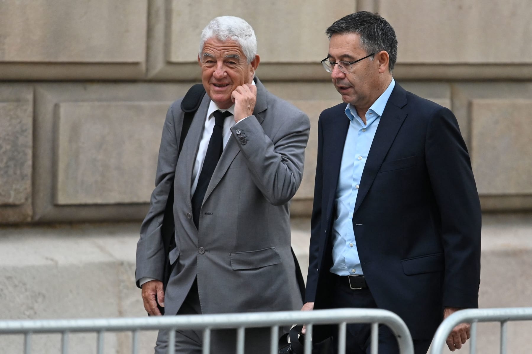 Former Barcelona's president Josep Maria Bartomeu (R) arrives at the courthouse in Barcelona on October 18, 2022, on the second day of Neymar's trial. - Just a month before the start of the World Cup, Brazilian superstar Neymar was expected to testify at his trial over alleged irregularities in his transfer to Barcelona nearly a decade ago. Neymar had been set to testify on either October 21 or 28 but the judge agreed to bring forward his hearing to avoid a clash with his football commitments. (Photo by Josep LAGO / AFP) (Photo by JOSEP LAGO/AFP via Getty Images)