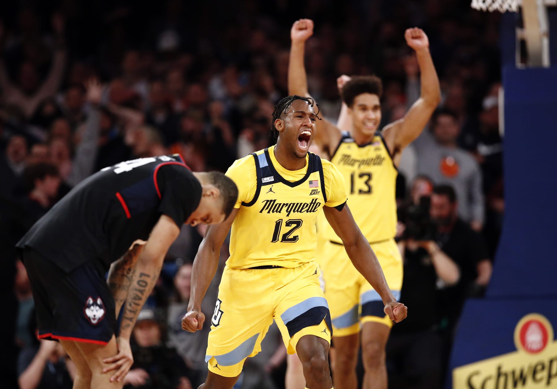 NEW YORK, NEW YORK - MARCH 10: Olivier-Maxence Prosper #12 of the Marquette Golden Eagles and Jordan Hawkins #24 of the Connecticut Huskies react after the buzzer during the second half in the Semifinal round at Madison Square Garden on March 10, 2023 in New York City. The Golden Eagles won 70-68. (Photo by Sarah Stier/Getty Images)