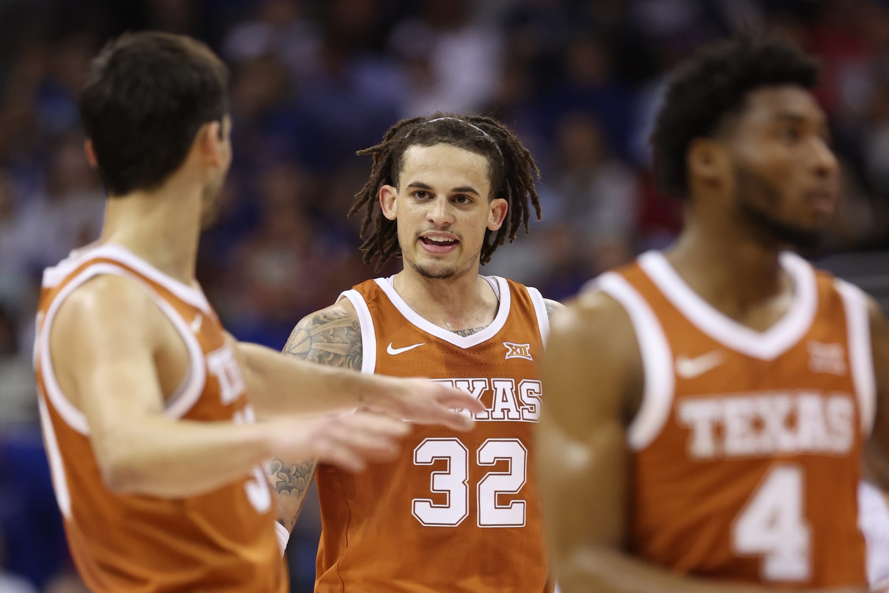 KANSAS CITY, MISSOURI - MARCH 11: Christian Bishop #32 of the Texas Longhorns celebrates a basket against the Kansas Jayhawks during the first half in the Big 12 Tournament Championship game at T-Mobile Center on March 11, 2023 in Kansas City, Missouri. (Photo by Jamie Squire/Getty Images)