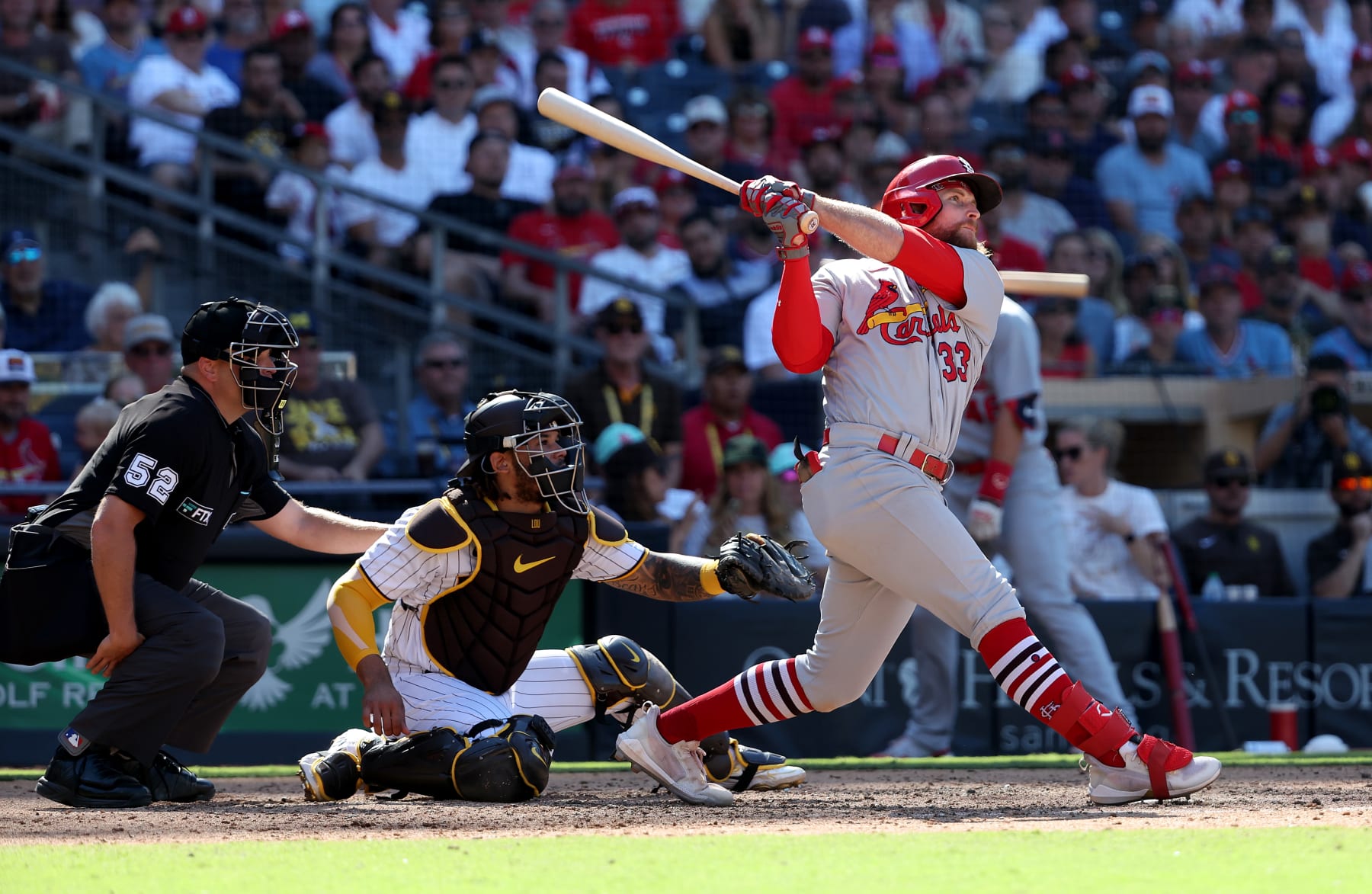 SAN DIEGO, CALIFORNIA - SEPTEMBER 22: Brendan Donovan #33 of the St. Louis Cardinals connects for a grand slam as Austin Nola #26 of the San Diego Padres looks on during the seventh inning of a game at PETCO Park on September 22, 2022 in San Diego, California. (Photo by Sean M. Haffey/Getty Images)