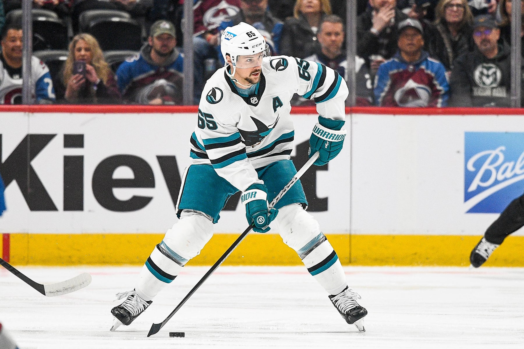 DENVER, COLORADO - MARCH 7: Erik Karlsson #65 of the San Jose Sharks skates against the Colorado Avalanche in a game at Ball Arena on March 7, 2023 in Denver, Colorado. (Photo by Dustin Bradford/Getty Images)