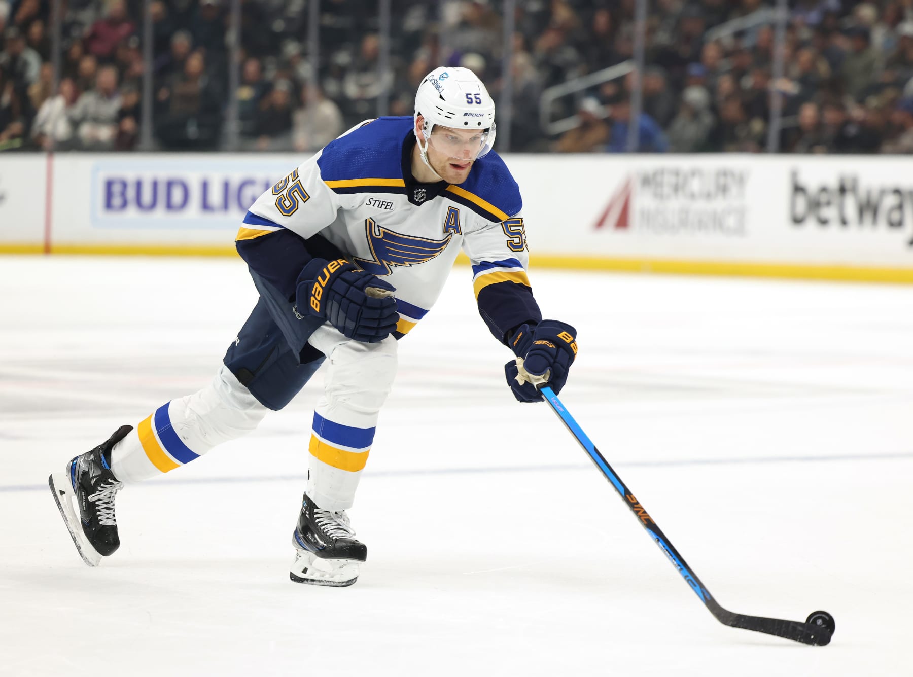 LOS ANGELES, CALIFORNIA - MARCH 04: Colton Parayko #55 of the St. Louis Blues reaches for the puck during a 4-2 Los Angeles Kings win at Crypto.com Arena on March 04, 2023 in Los Angeles, California. (Photo by Harry How/Getty Images)